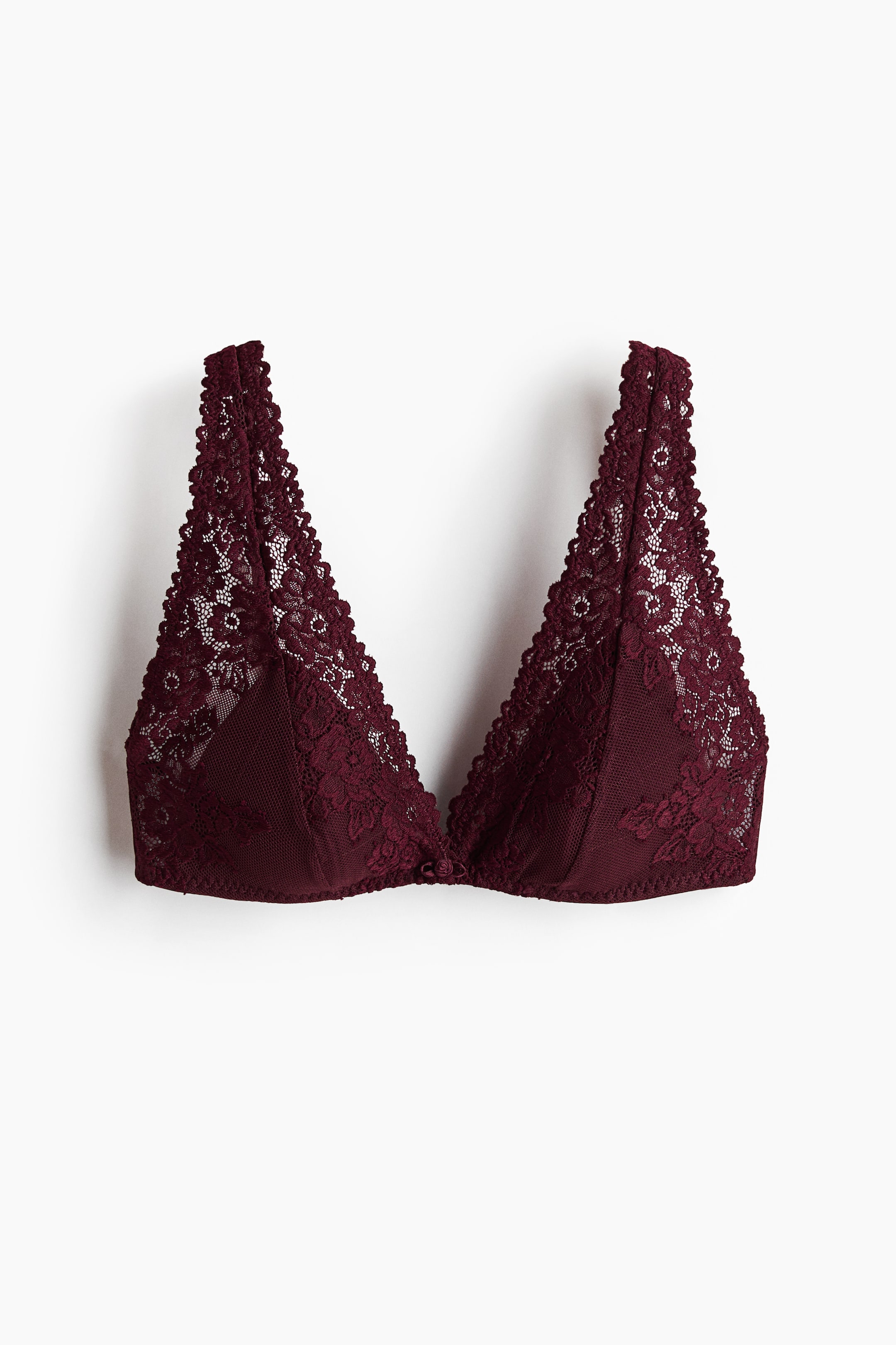 View larger image: A deep burgundy lace bralette is shown with triangular cups featuring a floral lace overlay and a mesh lining. It is laid flat, front-facing, and features wide lace straps and a small fabric bow at the center gore.