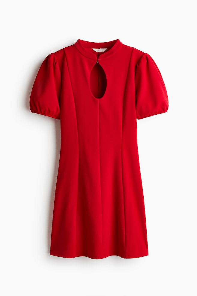 A red mini dress is shown facing front, featuring a high round neckline with a vertical keyhole opening at the chest and short puff sleeves with elasticated cuffs. Vertical princess seams are running down the fitted bodice, which transitions into a gently flared skirt. - 1