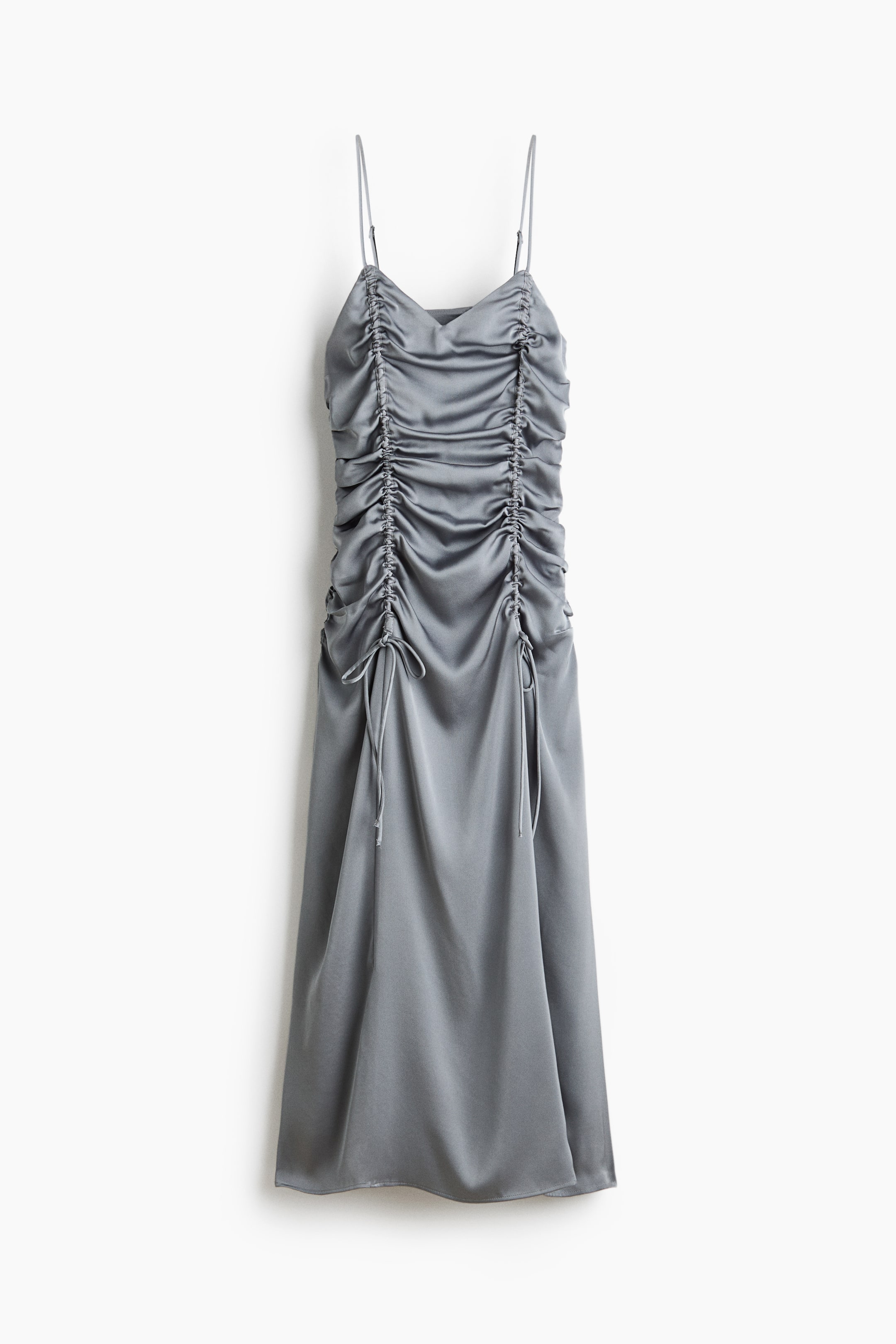 View larger image: A grey satin slip dress comes with slender spaghetti straps and falls to a midi length. The front of the dress highlights extensive vertical ruching, managed by multiple drawstrings tied into small bows.