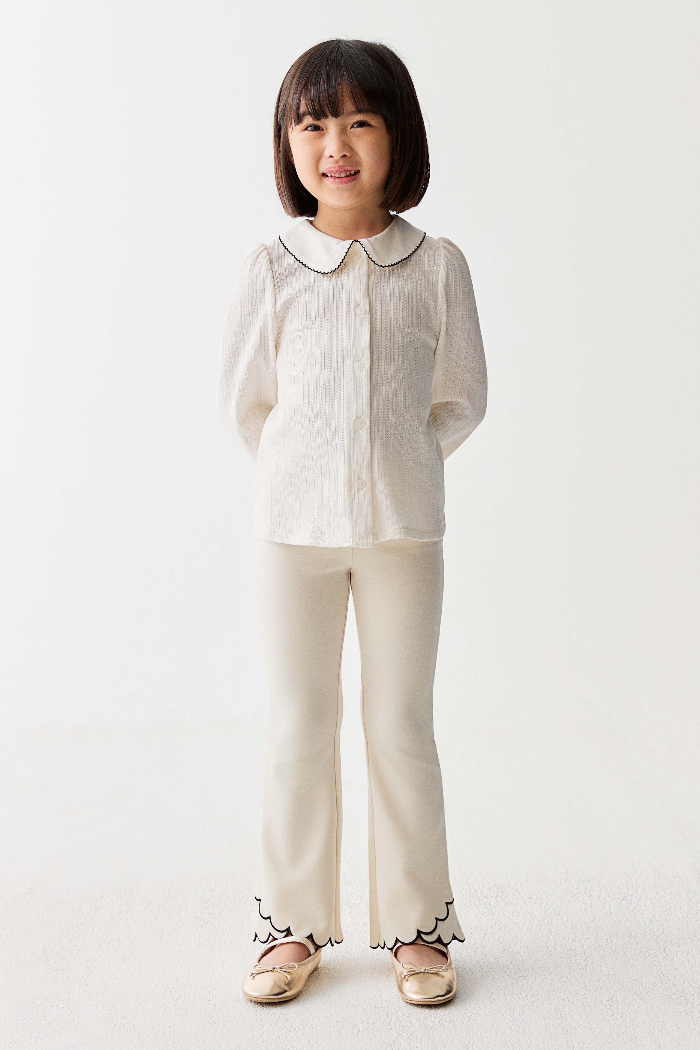 Scalloped-hem flared leggings - Cream/Black