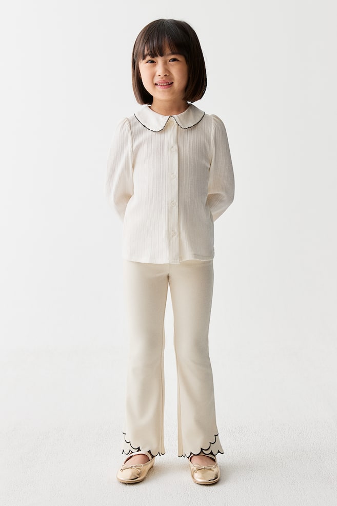 Scalloped-hem flared leggings - Cream/Black - 2