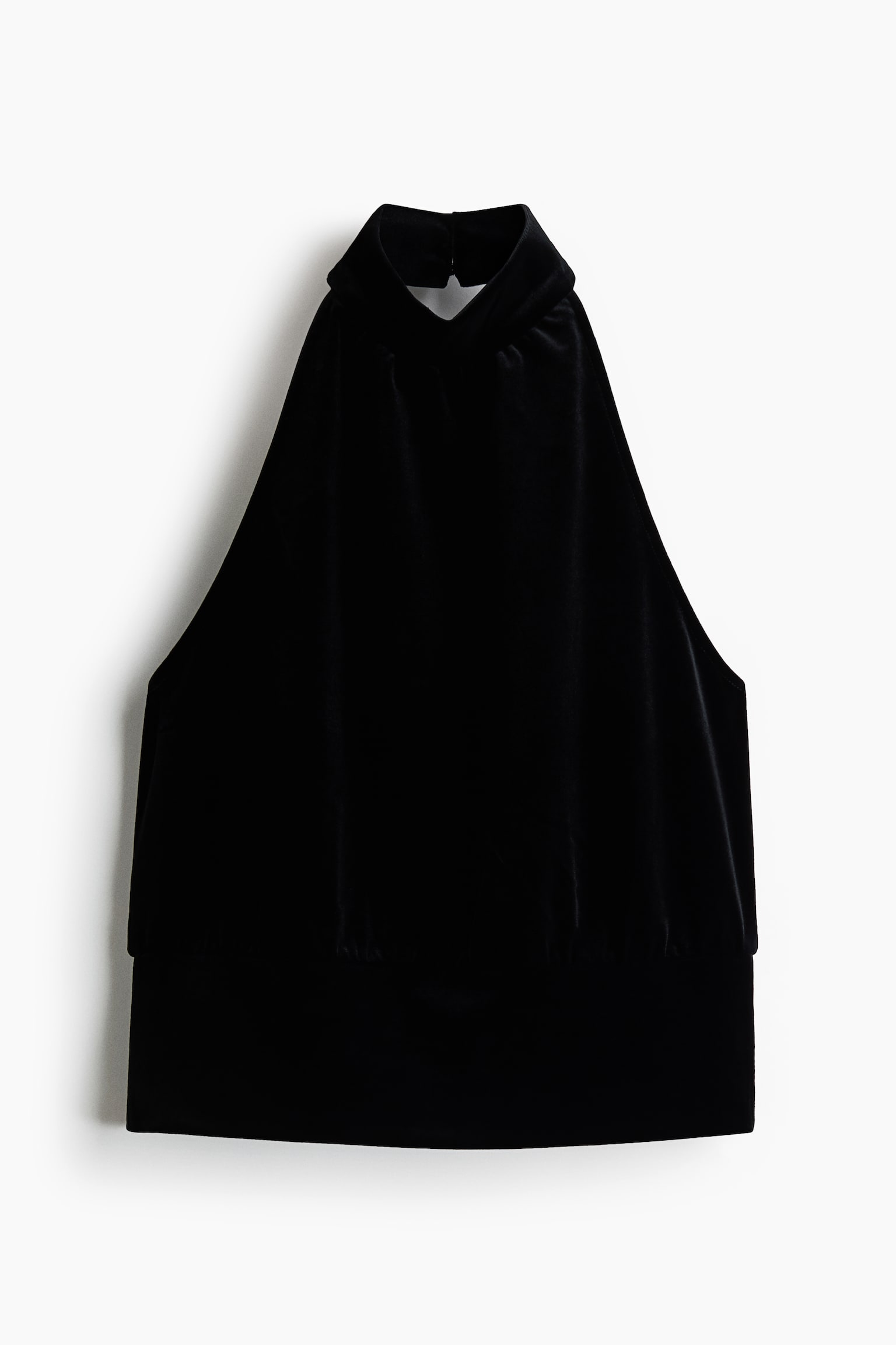 A black halterneck top is shown from the front, featuring a soft, plush texture with a high, gathered neckline. The sleeveless design tapers down to a wide, fitted waistband with subtle gathers along its top edge.