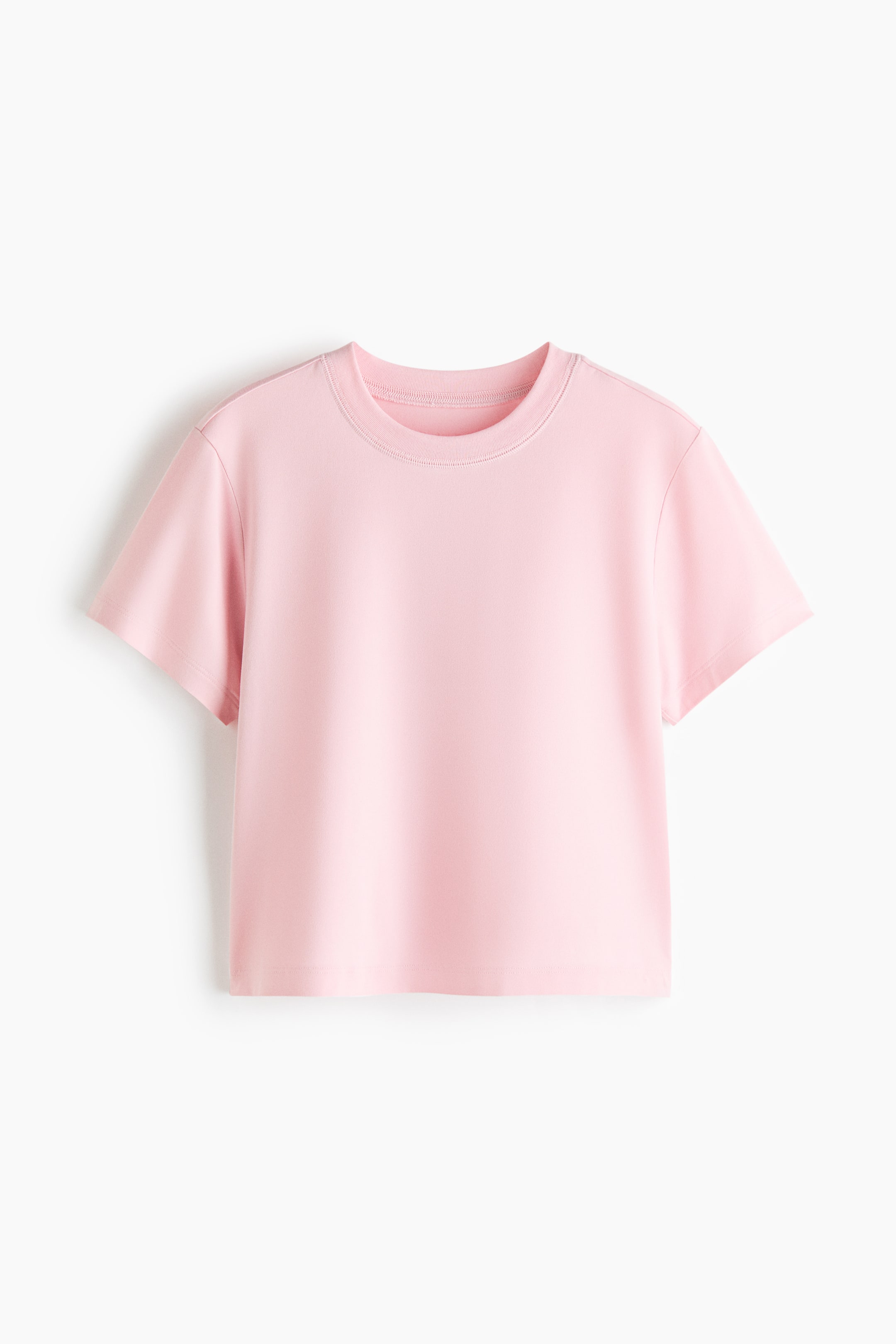 Größeres Bild ansehen: Loose Fit Sport-T-Shirt mit SoftMove? zeigt ein rosa, locker sitzendes, kurzes Design mit Rundhalsausschnitt und kurzen Ärmeln, während sichtbare Nähte den Halsausschnitt detaillieren.