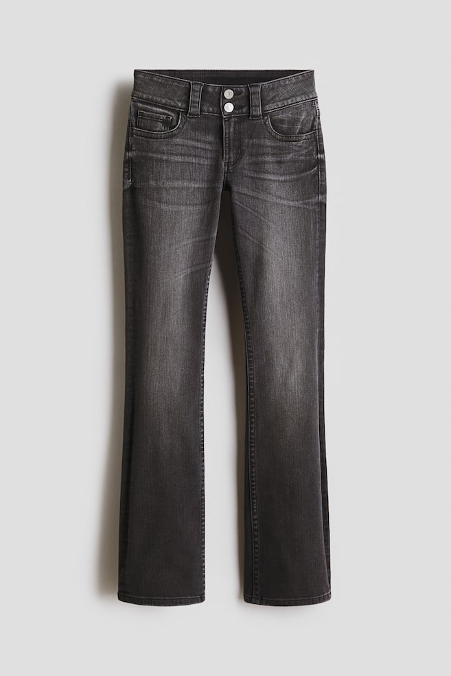 Dark grey jeans are showcasing a faded wash and a bootcut leg, featuring a two-button fastening at the front, belt loops, and curved front pockets. - 1