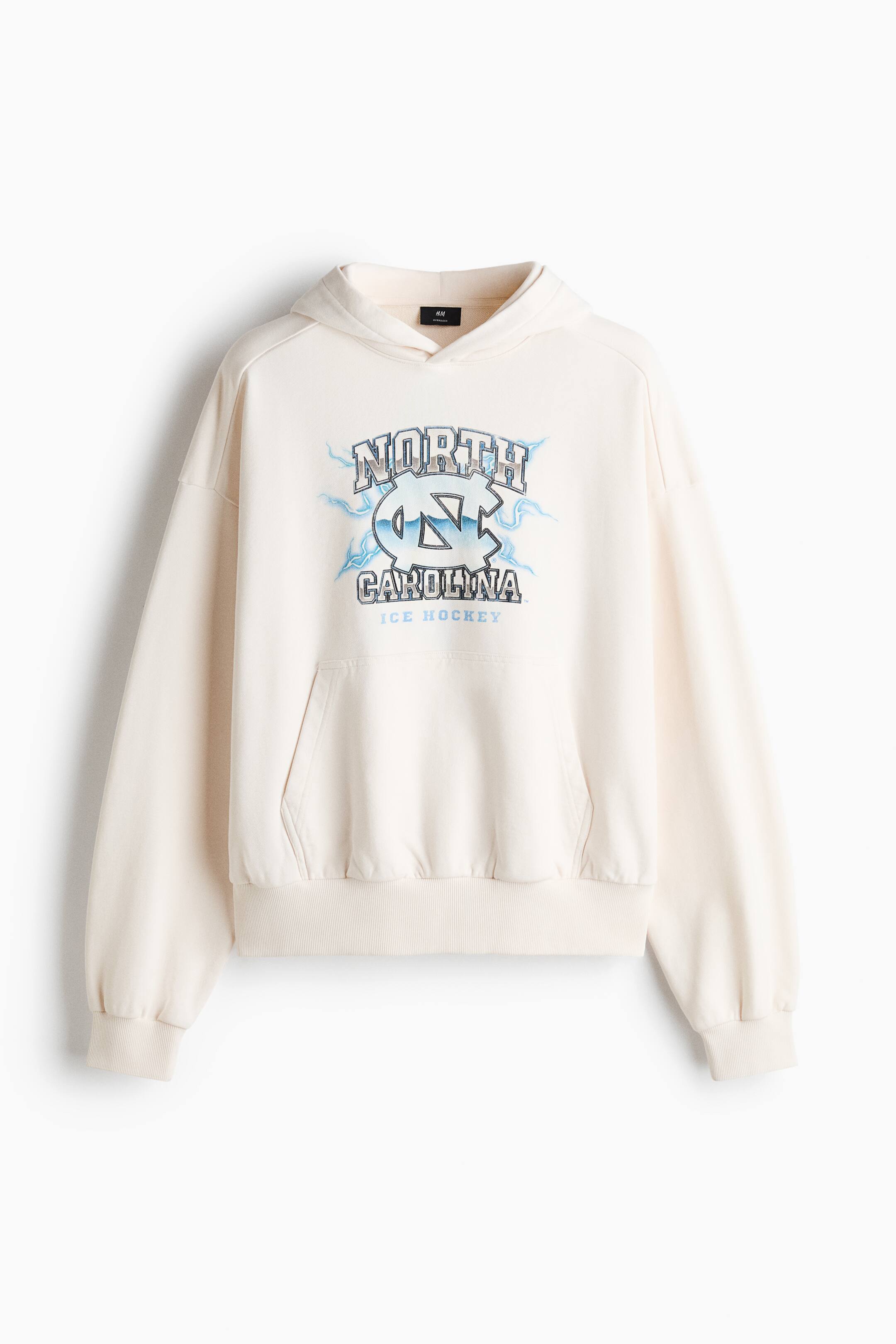 View larger image: Oversized Fit Printed cotton hoodie - Cream/UNC - Men | H&M 1