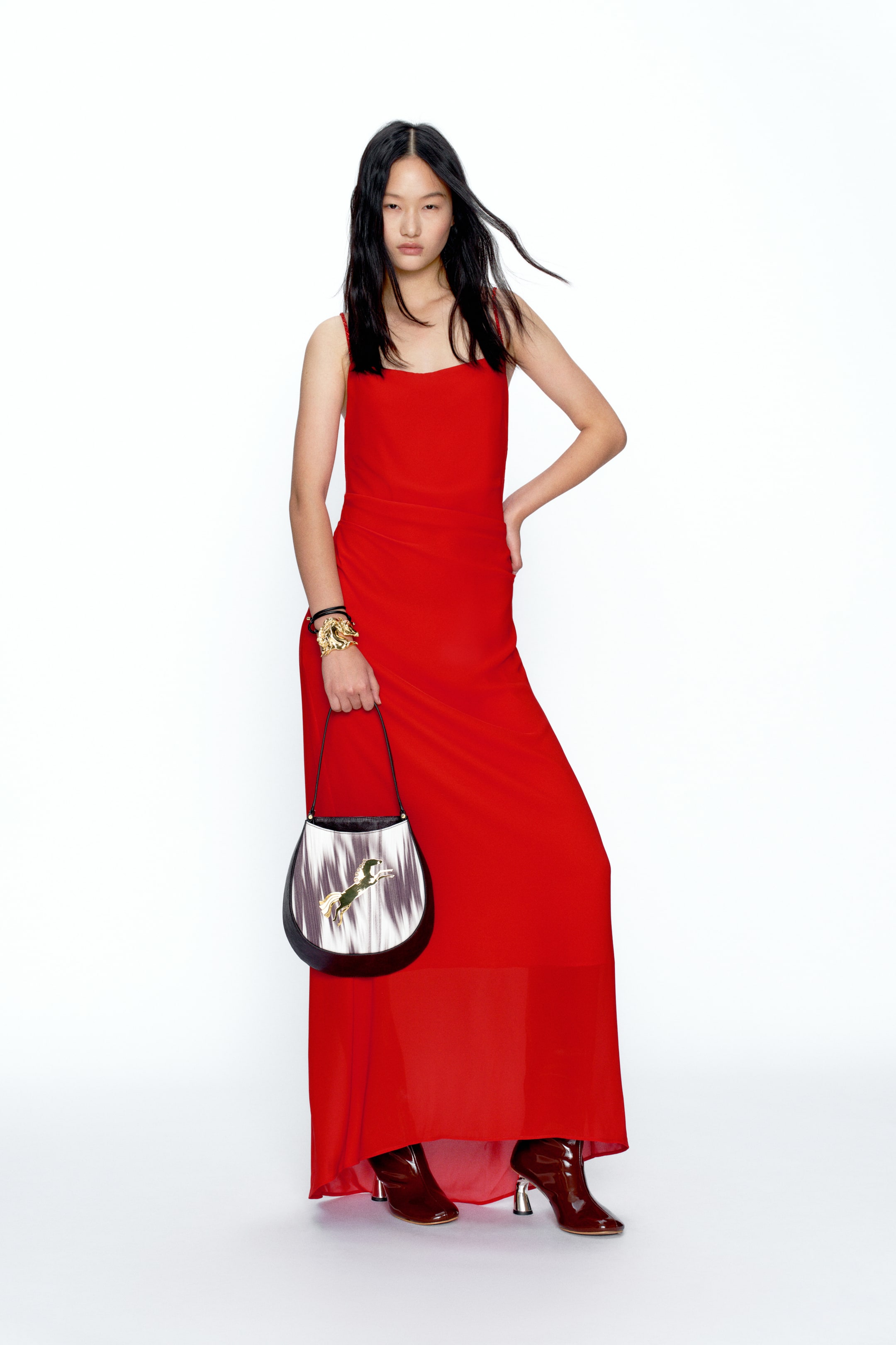 View larger image: A red maxi dress featuring a square neckline and slim shoulder straps, designed with a straight, floor-length silhouette.