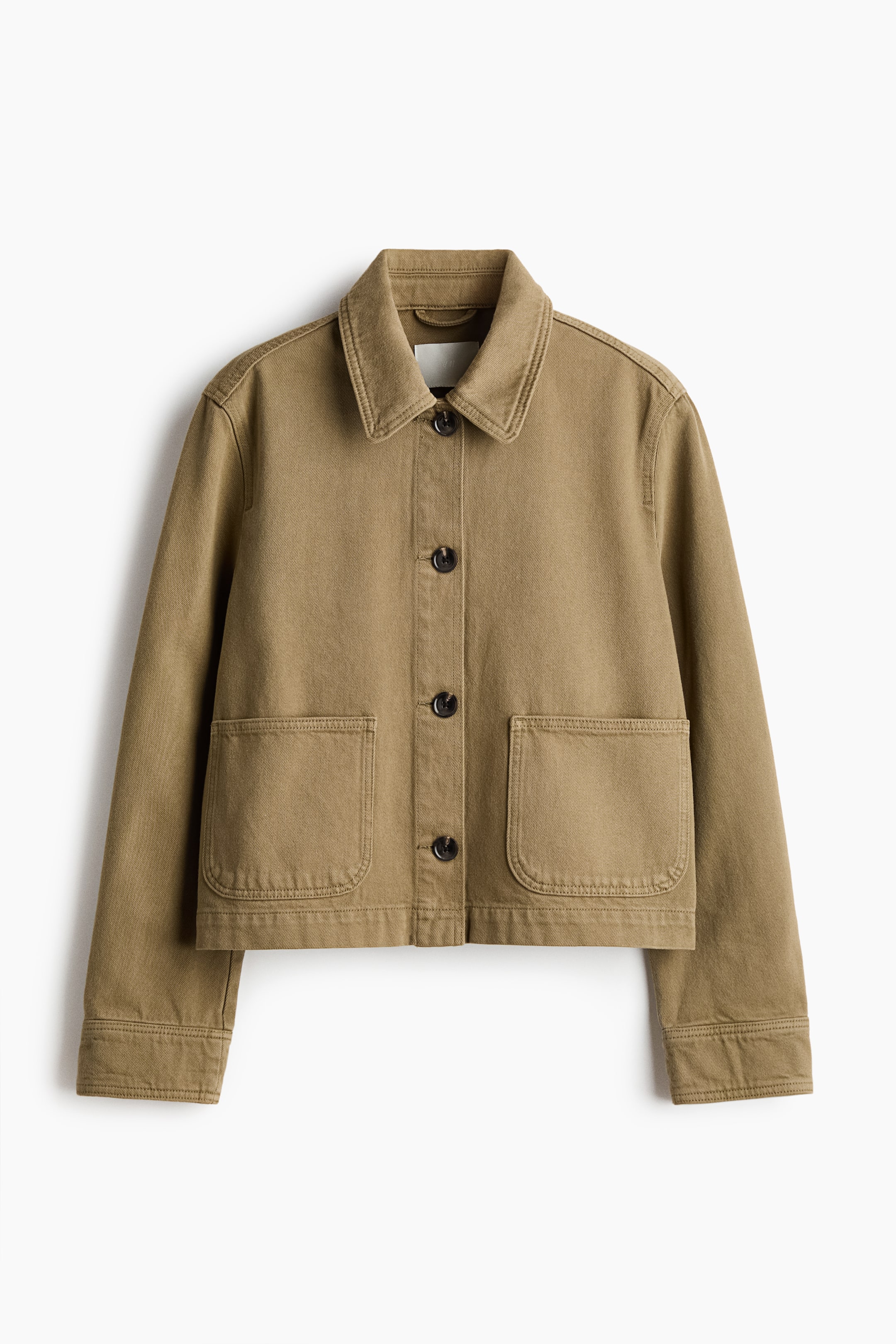 View larger image: An olive green cropped utility jacket is shown from the front, highlighting a classic collar and a button-front closure with four dark buttons. It also features two large patch pockets at the waist, long sleeves with buttoned cuffs, and visible topstitching accentuating all seams.
