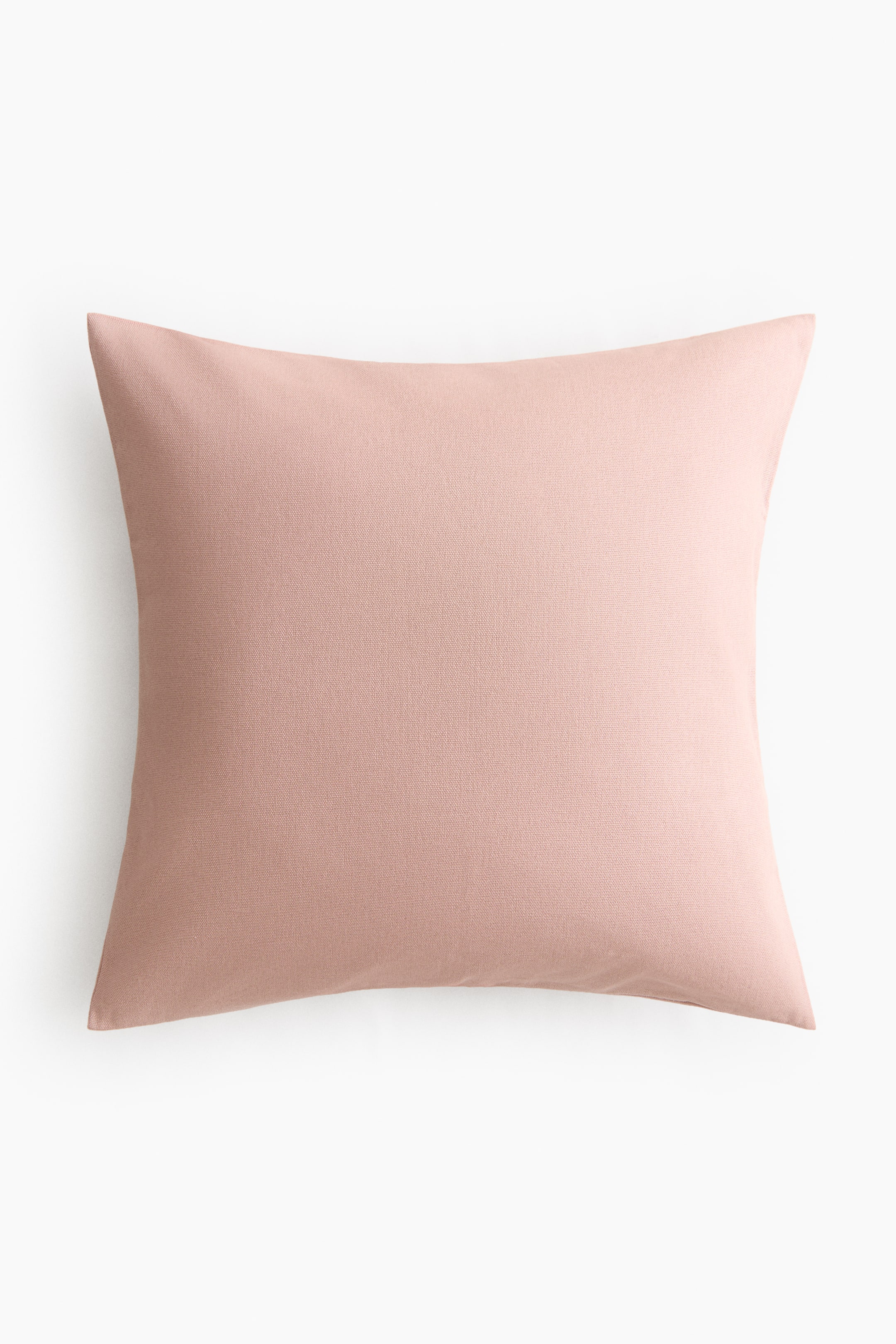 View larger image: A cushion cover in a light pink color is presented front-facing. 