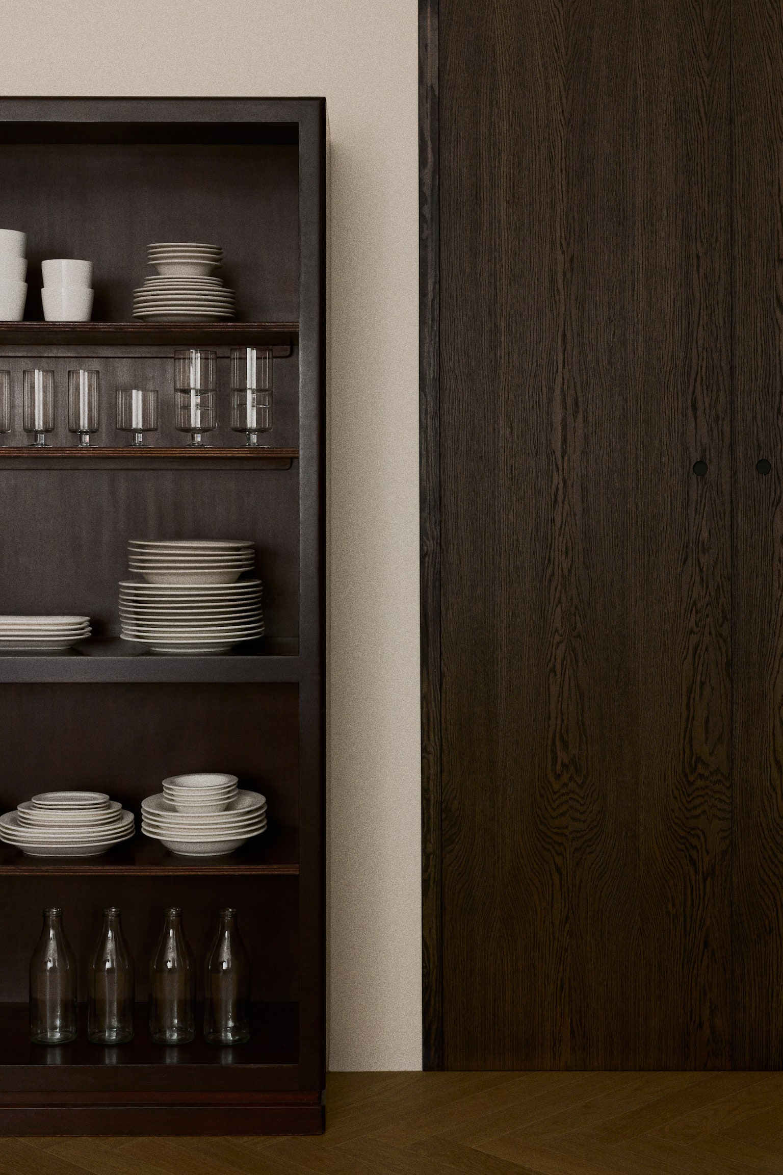 Two round, light beige plates are shown from an overhead view, each featuring a slightly raised rim and arranged vertically. - 1