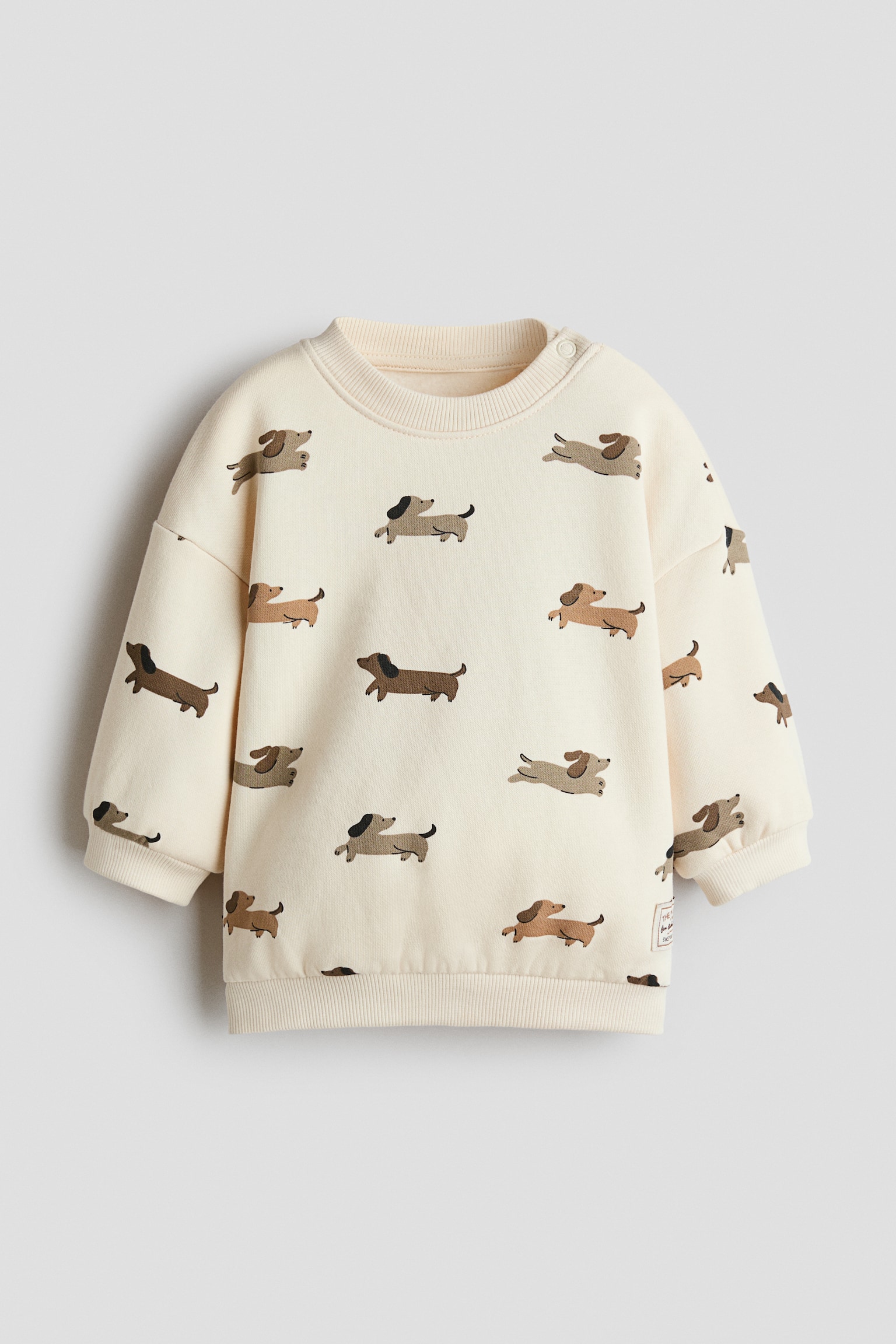 Sweater met print - Lichtbeige/honden/Donkerbruin/teddybeer/Dusty lichtblauw/Boo!/Lichtbeige/Paris/Marineblauw/Little Bro/Lichtgroen/dino's/Marineblauw/heelal/Wit/auto‘s/Donkerrood/NYC/Lichtgroen/dino/Roomwit/auto's