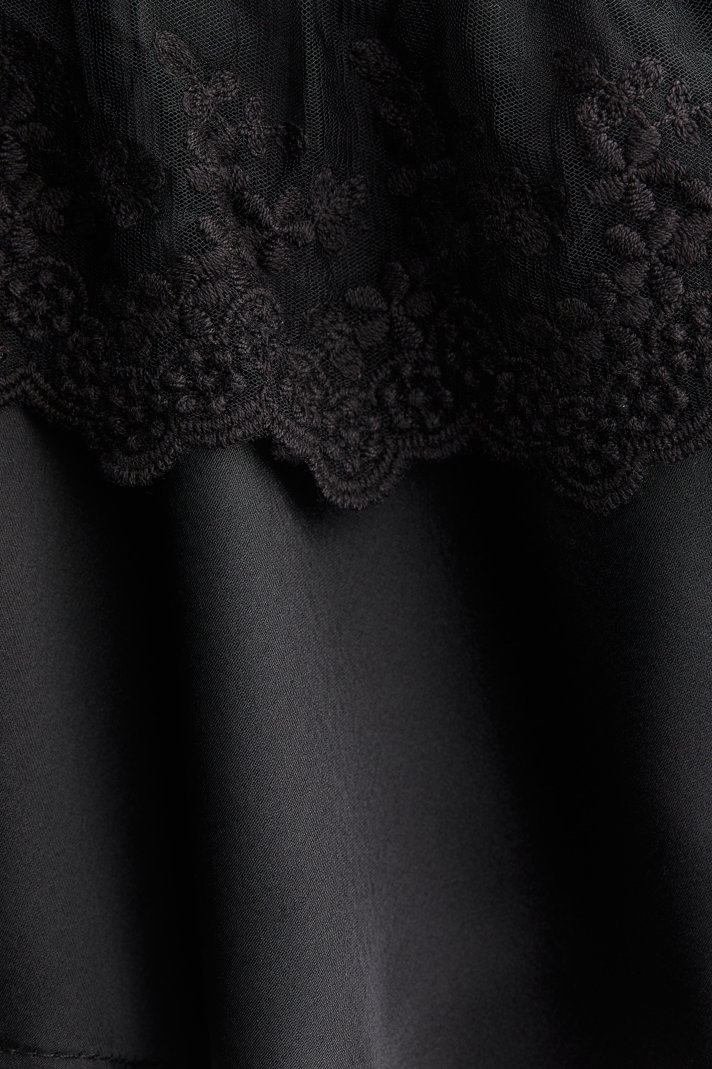 Flounce-trimmed satin blouse