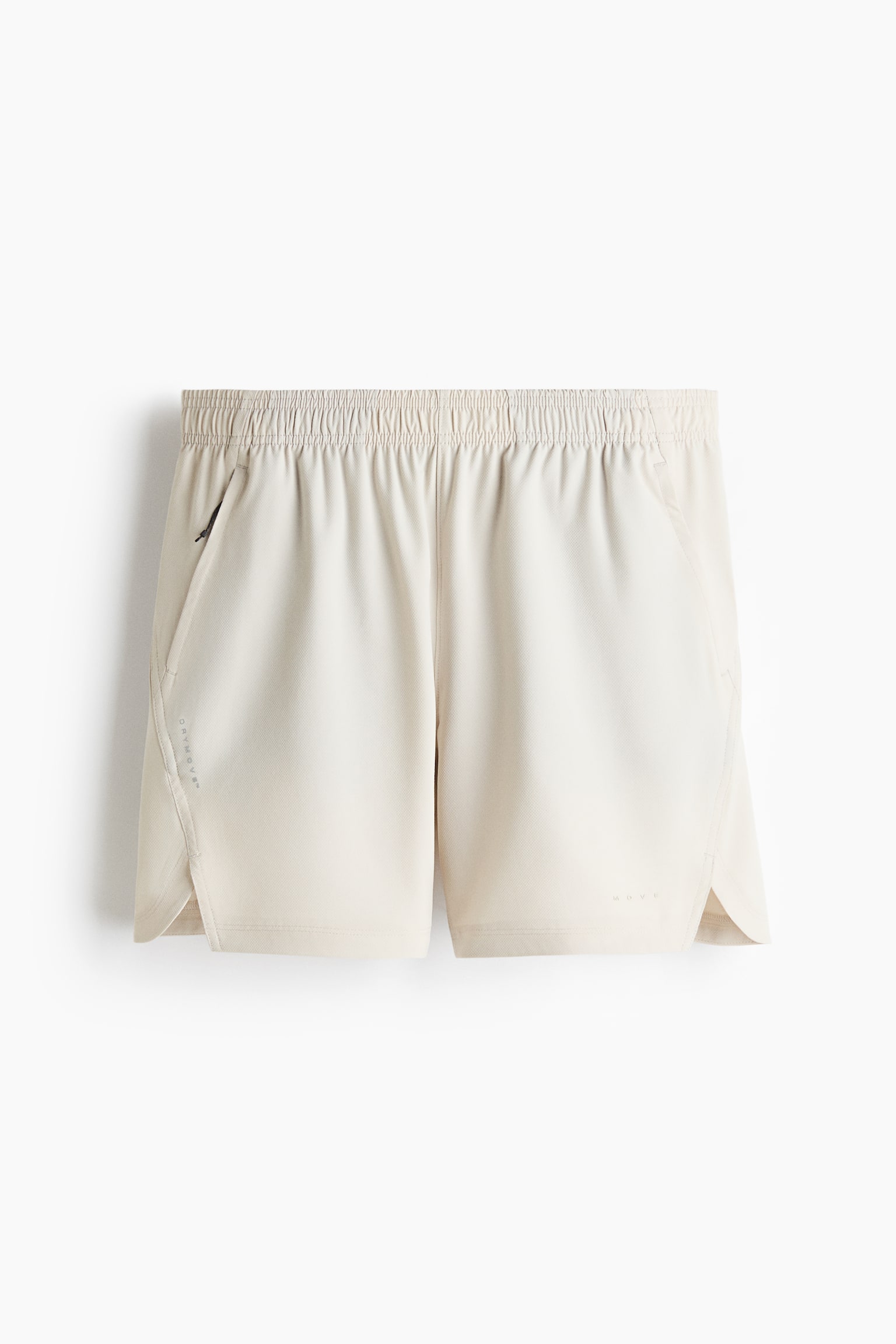 Les shorts de sport sont présentés dans une couleur beige clair, face avant, avec une taille élastiquée et une poche zippée sur le côté gauche. Des fentes latérales apparaissent aux ouvertures des jambes, avec le texte "DRYMOVE" positionné verticalement sur le panneau latéral gauche et "MOVE" horizontalement sur le panneau avant inférieur droit. - 1
