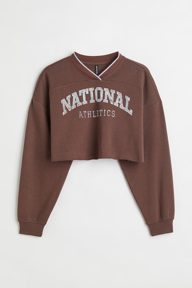 H&M+ Cropped sweatshirt - Dark brown/National Athletics - 1