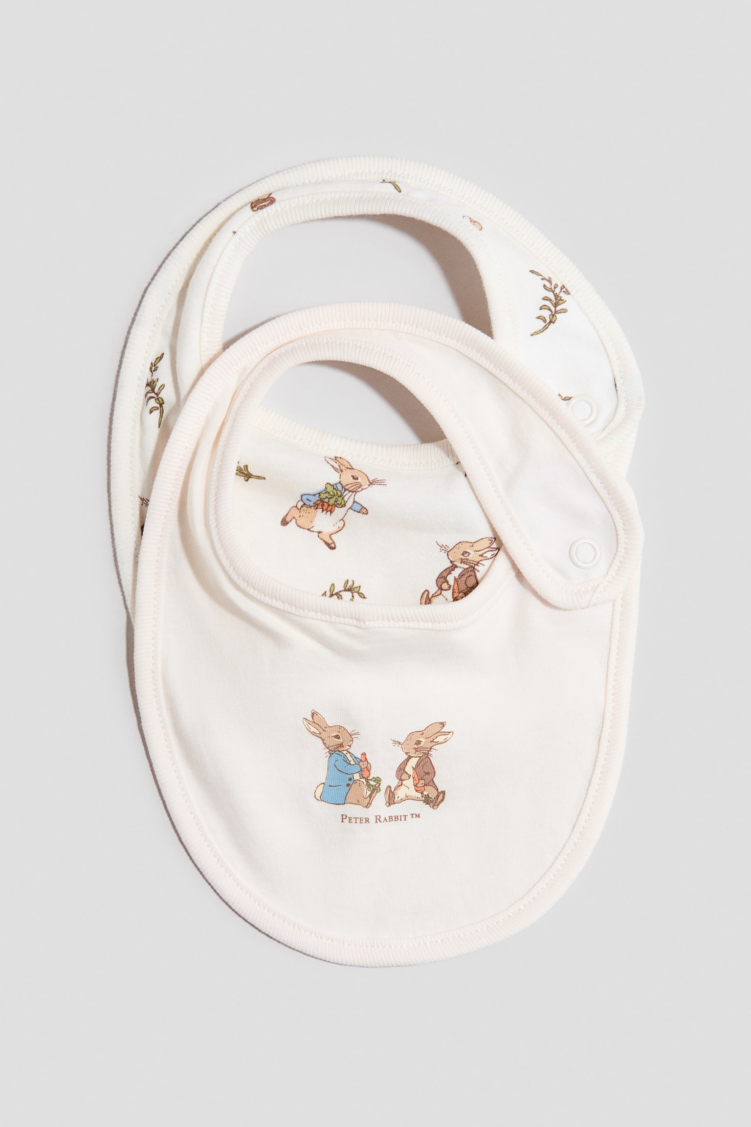 2-pack printed cotton jersey bibs - Cream/Peter Rabbit - 1