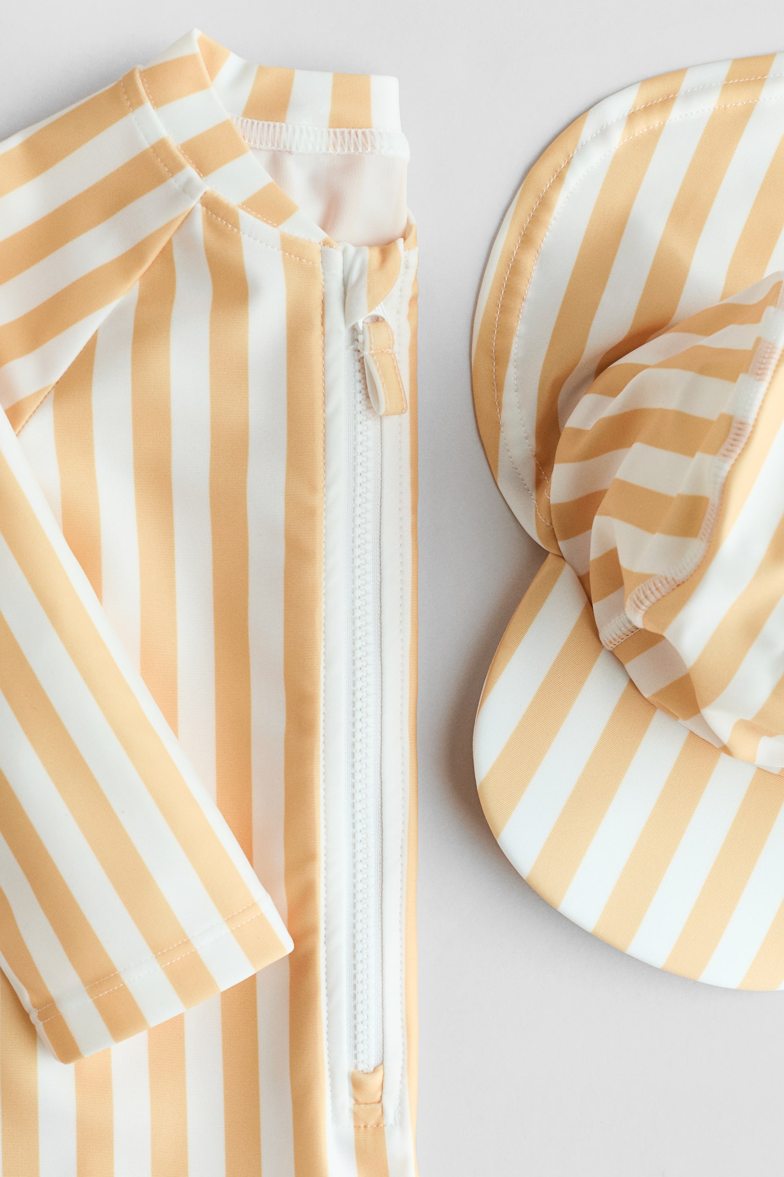 UPF 50 Sun protection set - Yellow/White striped/Light pink/Cherries/Pink/Floral/Light beige/Animals/White/Marine animals/Light blue/Striped/Peach/Fish/Cream/Floral/Light turquoise/Palm trees/Cream/Fish/Light green/Leopard/Light beige/Leopard print/Light blue/Patterned/Cream/Pineapples - 2