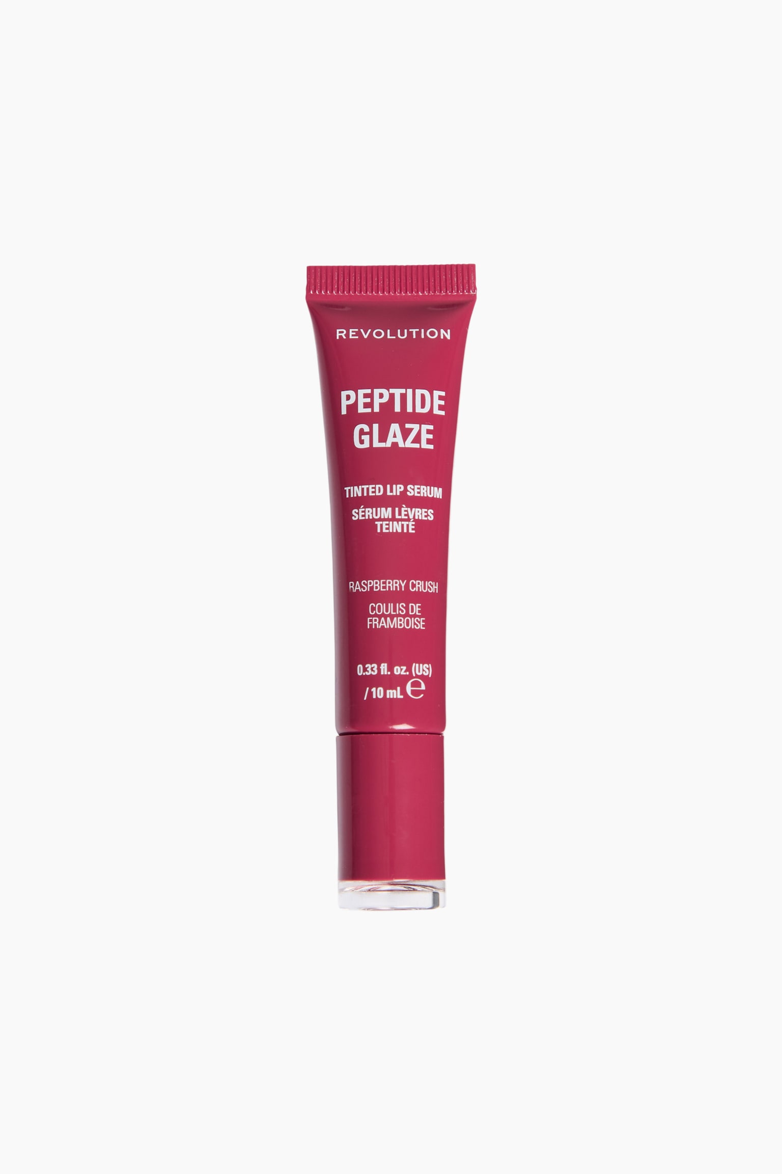 Peptide Glaze Tinted Lip Serum stÃ¥r upprätt i frontläge och visar sin hallonrosa klämtub samt ett matchande cylindriskt lock med genomskinlig bas. Framsidan av tuben visar vit text som anger varumärket Revolution, produktnamnet och nyansen âRaspberry Crush.â