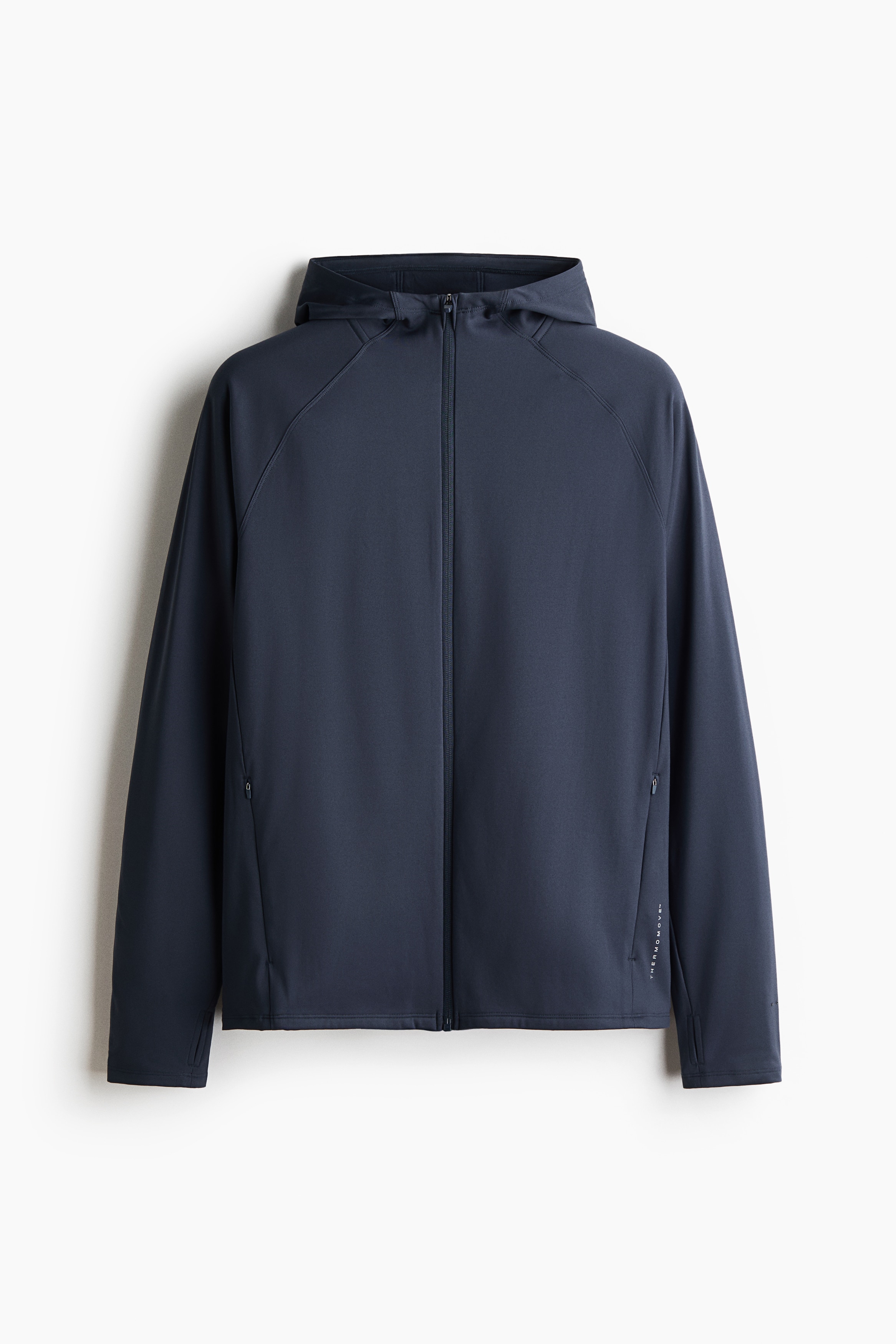 A dark navy blue athletic jacket is hanging front-facing, featuring a full-length front zip and an attached hood. The jacket shows raglan sleeves, two discreet zipped side pockets, and a clean, smooth fabric finish.