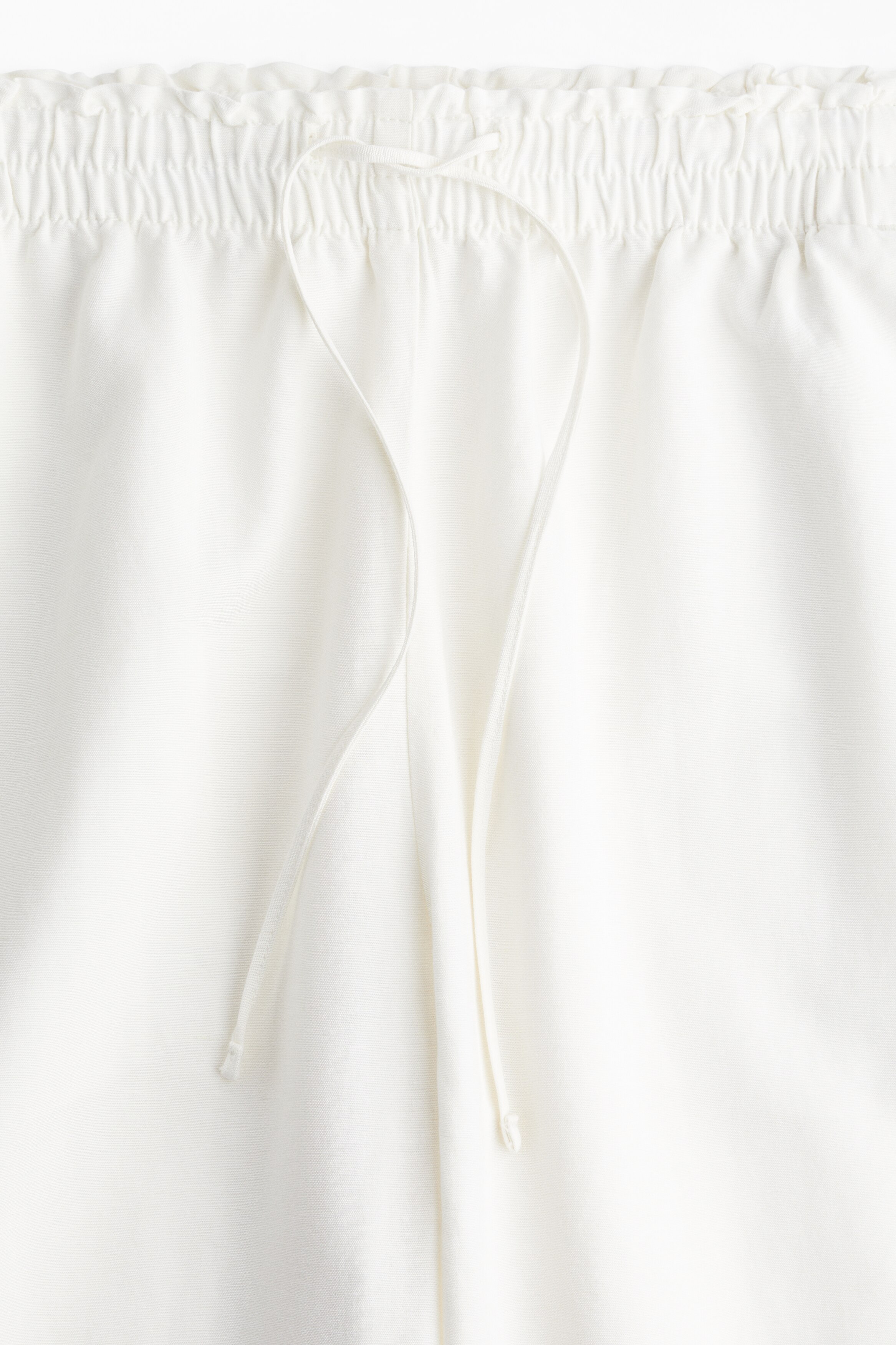 Cropped linen-blend trousers