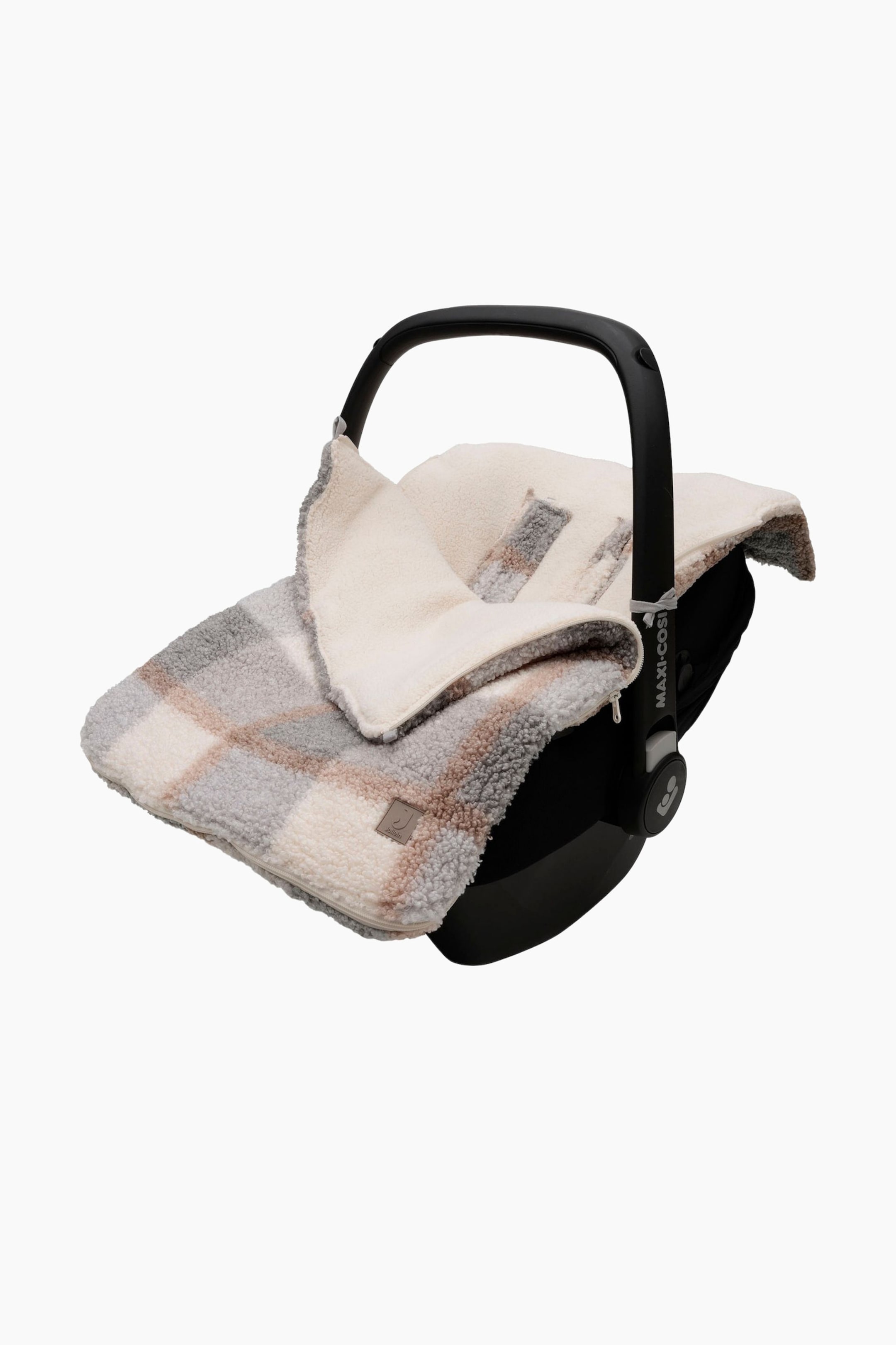 View larger image: A car seat footmuff is covering a black baby car seat, angled forward and slightly left. The footmuff is featuring a cream, light gray, and light brown checkered pattern on its plush sherpa exterior, with a smooth cream interior lining. A zipper is running along its left side.