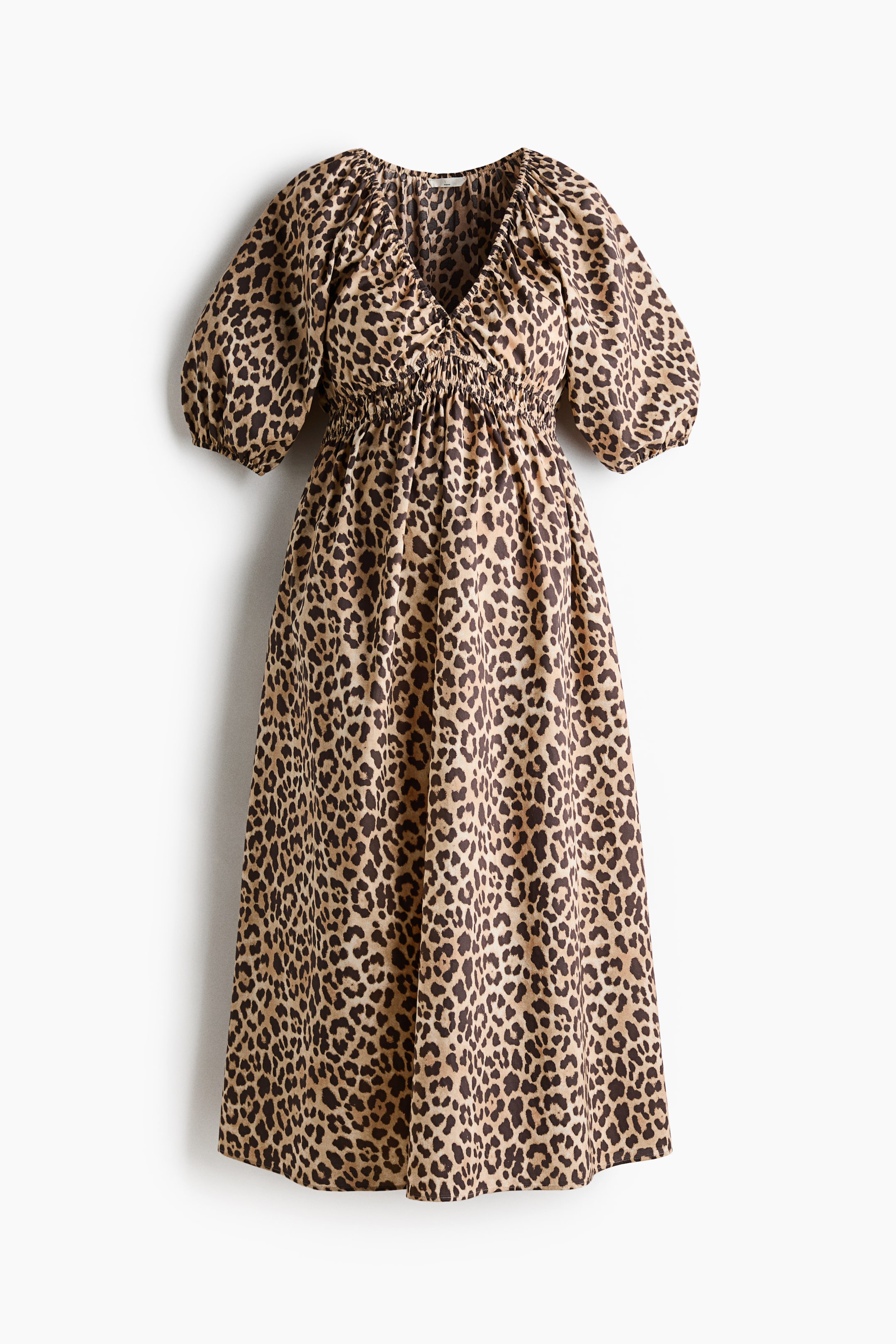 View larger image: A leopard print midi dress featuring a V-neckline, voluminous short sleeves, and a shirred waist, flowing into a full skirt.
