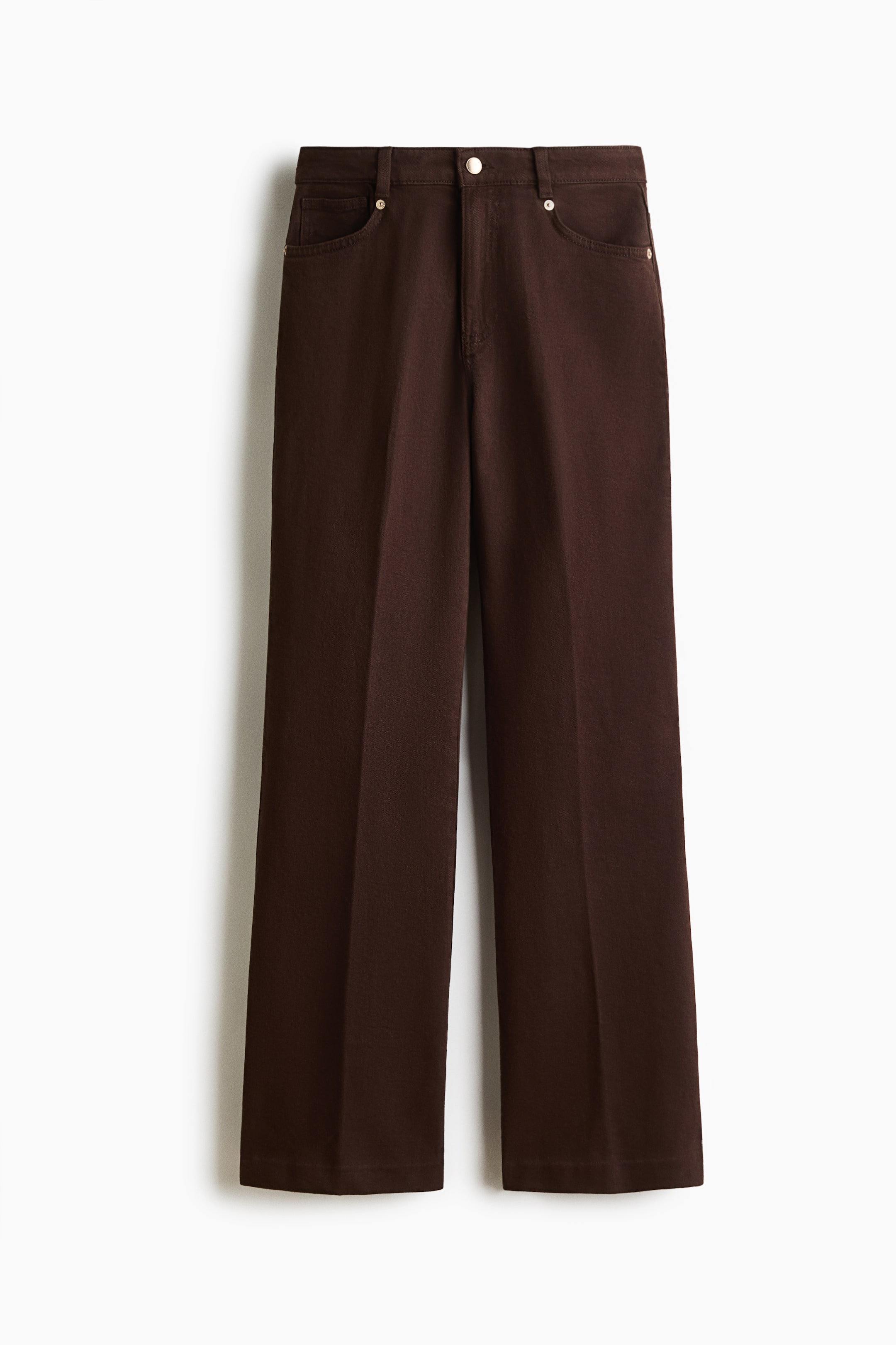 View larger image: Brown trousers are shown from the front, featuring a standard waistband with belt loops, a silver-toned button fastening and a zip fly. Two curved front pockets with rivets are visible, and the wide, straight legs show a subtle front crease.