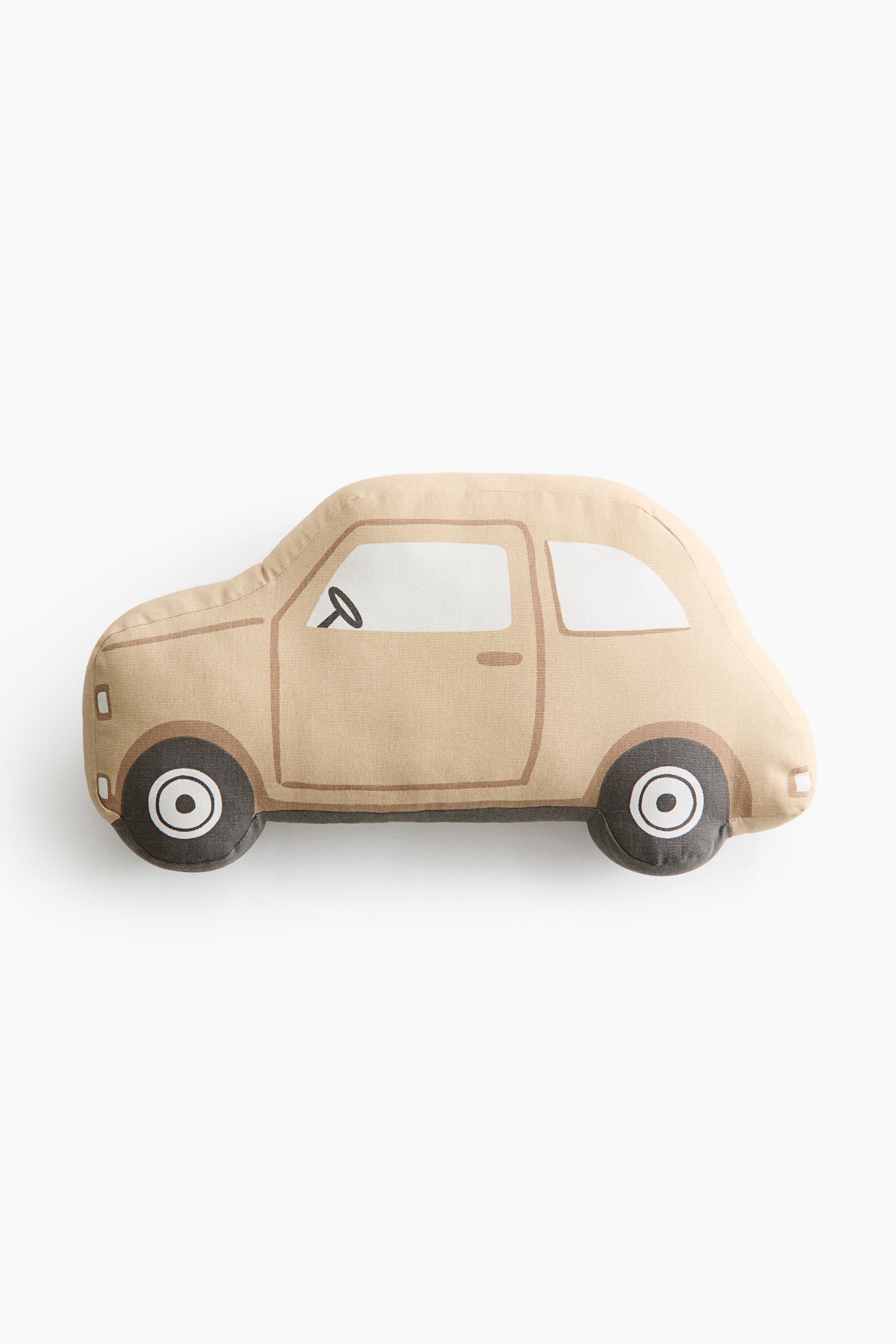 View larger image: A car-shaped plush cushion is shown in side profile, featuring a vintage-style car in a light beige colour. The cushion includes printed details such as white windows, a black steering wheel, brown door outlines, and dark grey wheels with white hubcaps.