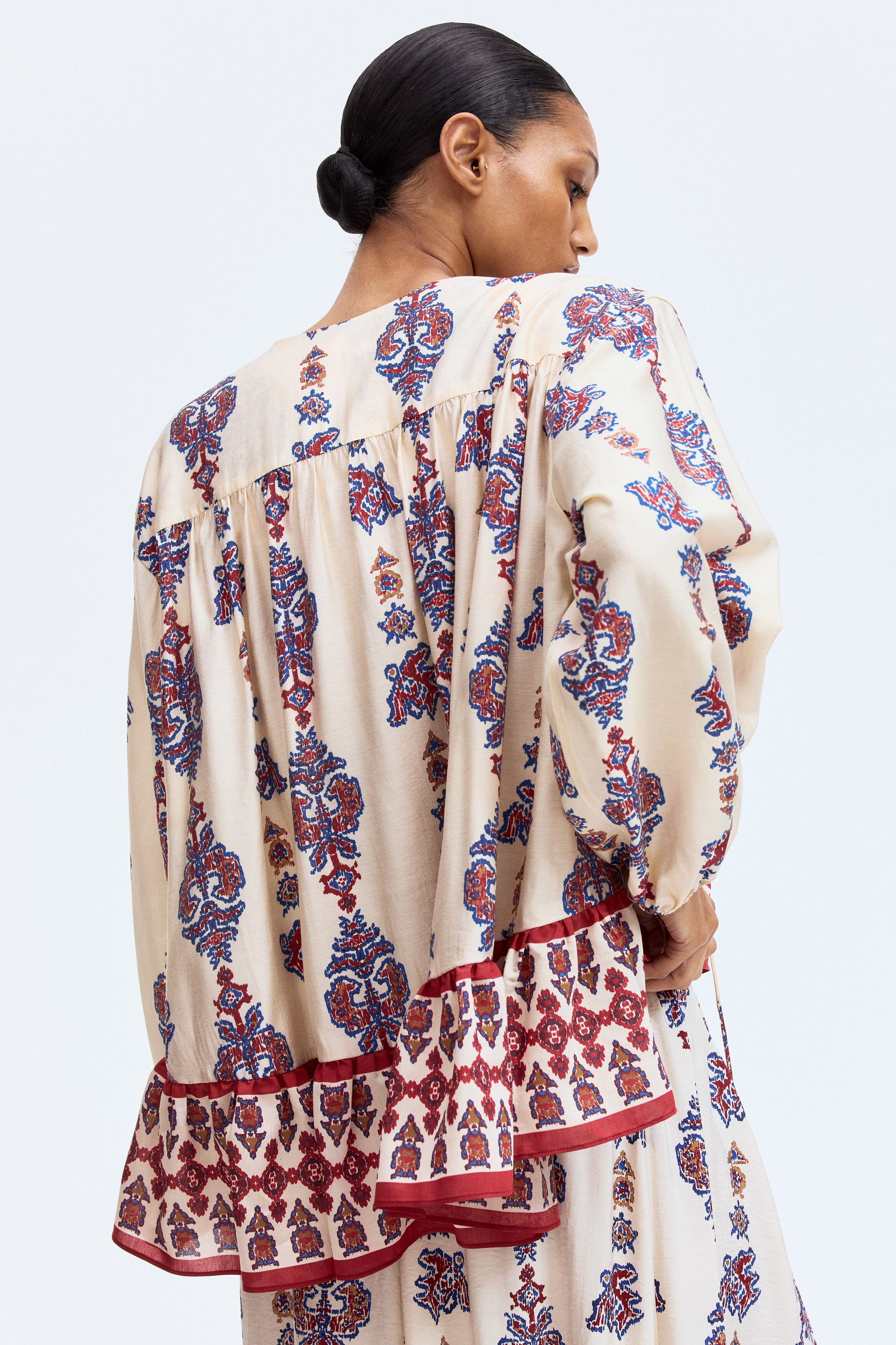Flounce-trimmed blouse
