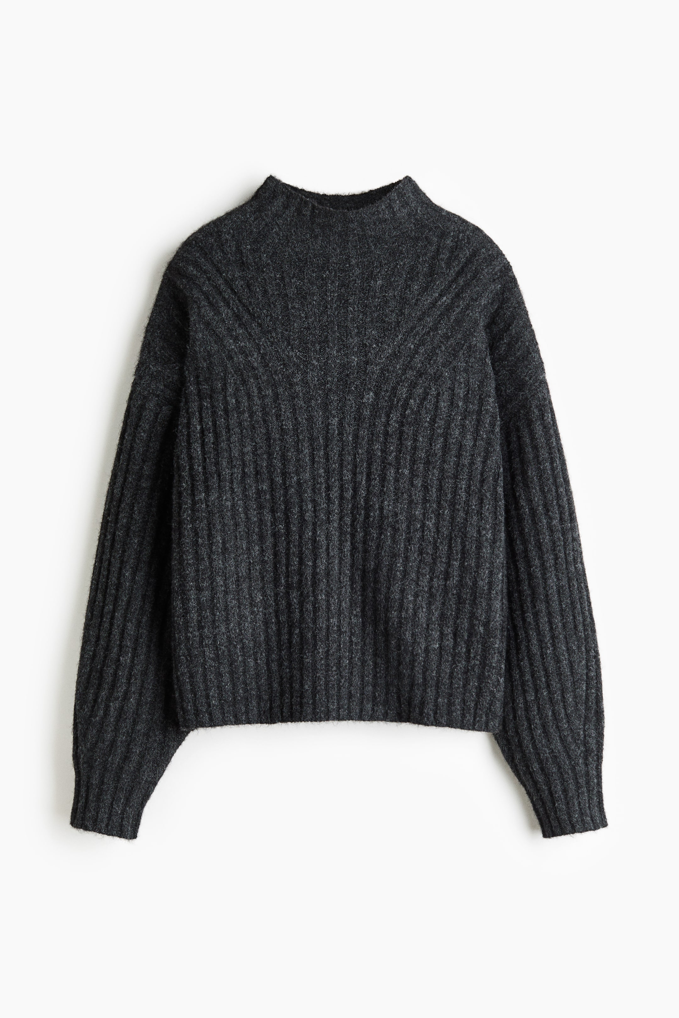 View larger image: A dark grey jumper in a textured rib knit is shown from the front, featuring a mock turtleneck, dropped shoulders, and long sleeves with ribbed cuffs. The vertical ribbing pattern curves near the neckline and extends straight down to a straight hem.