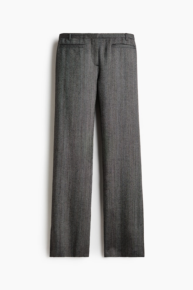 A pair of dark grey, textured trousers is shown from the front, featuring a straight-leg silhouette with a subtle vertical pattern. The design includes a structured waistband with belt loops and horizontal welt pockets at the hips. - 1