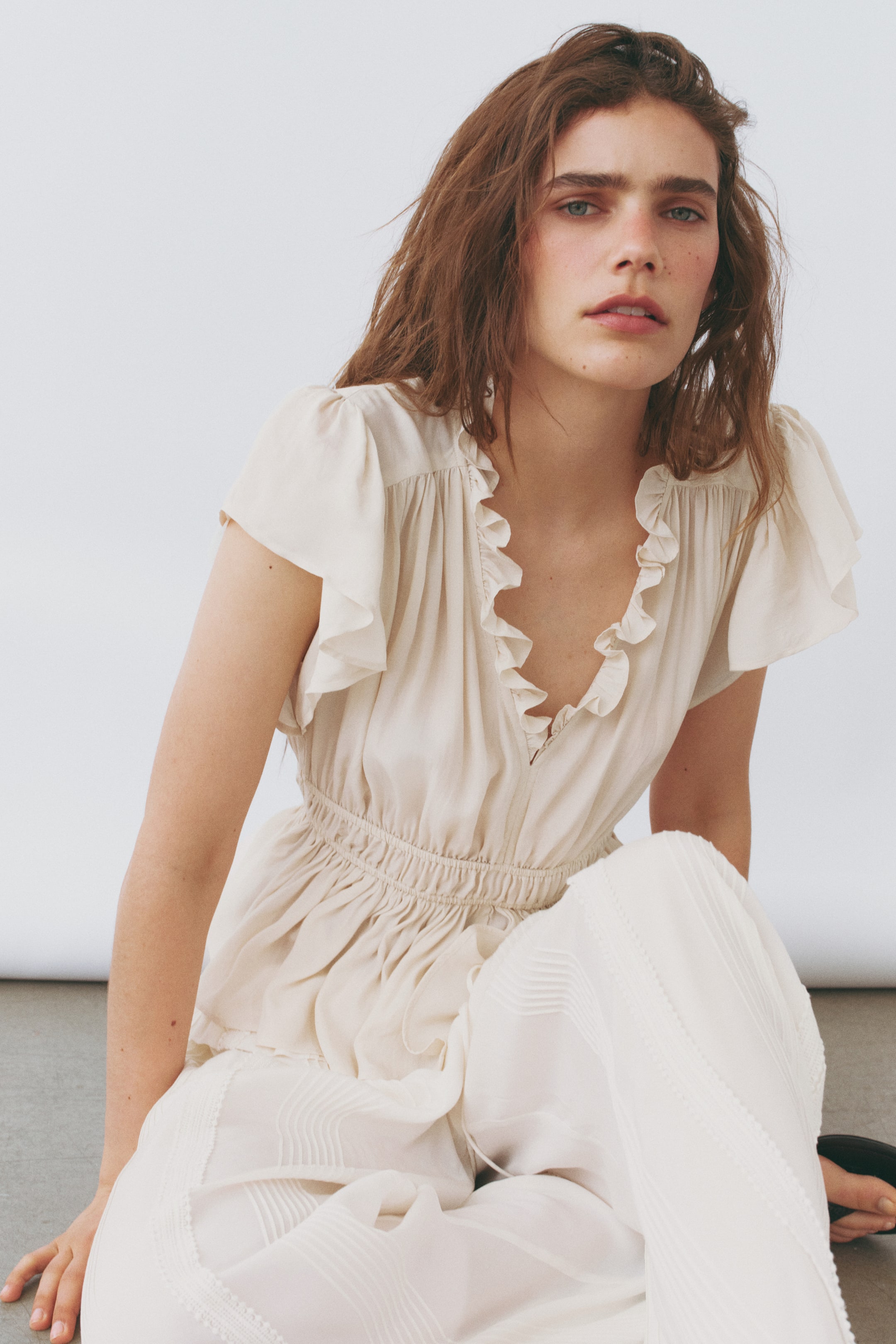 Flutter-Sleeved Peplum Blouse