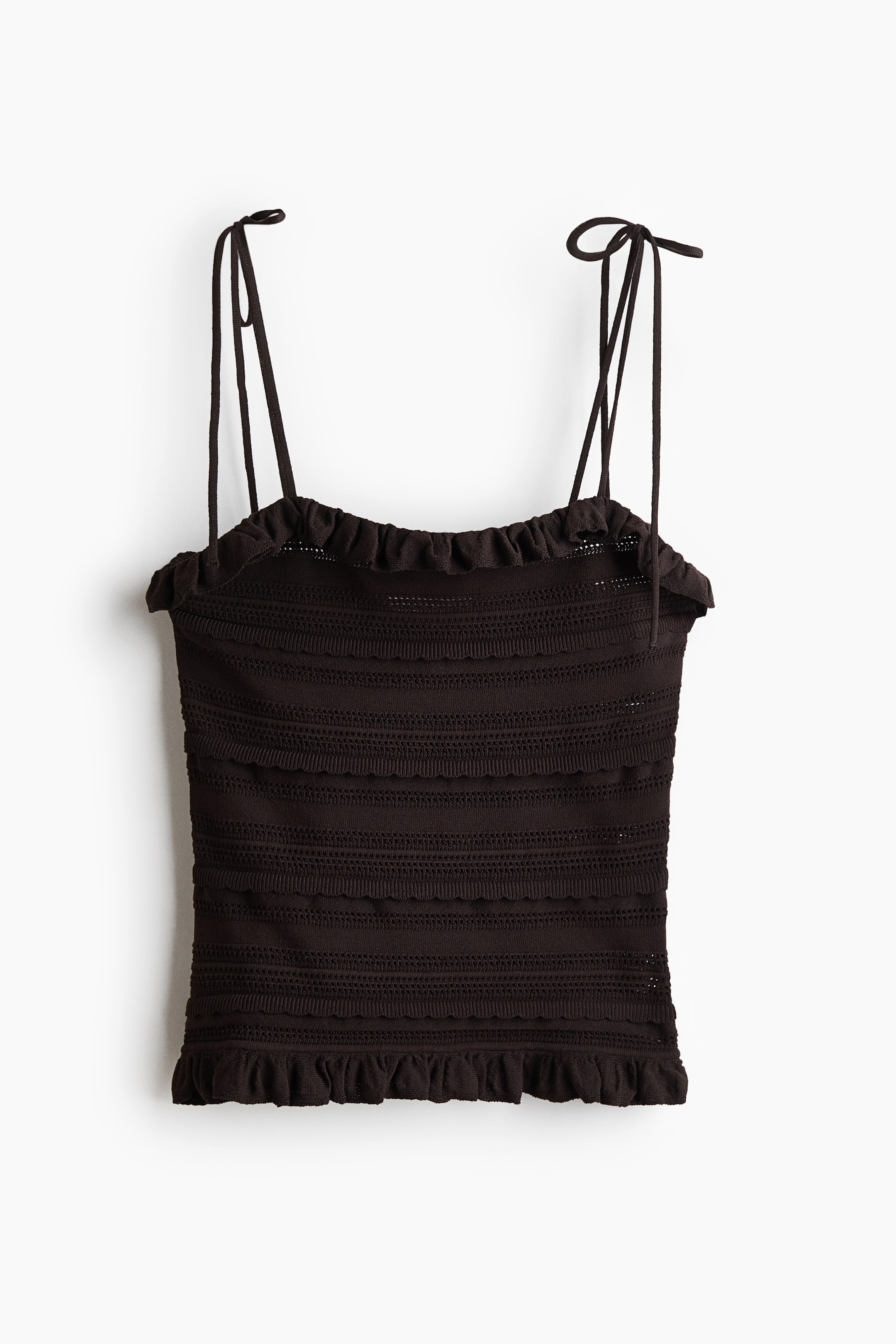 Ver imagen más grande: Se presenta una camiseta de tirantes marrón oscuro vista desde el frente, con tirantes finos ajustables que se atan en lazos en los hombros. Su cuerpo muestra bandas horizontales de texturas alternas entre sólido y punto abierto, con volantes fruncidos en el escote y el dobladillo.