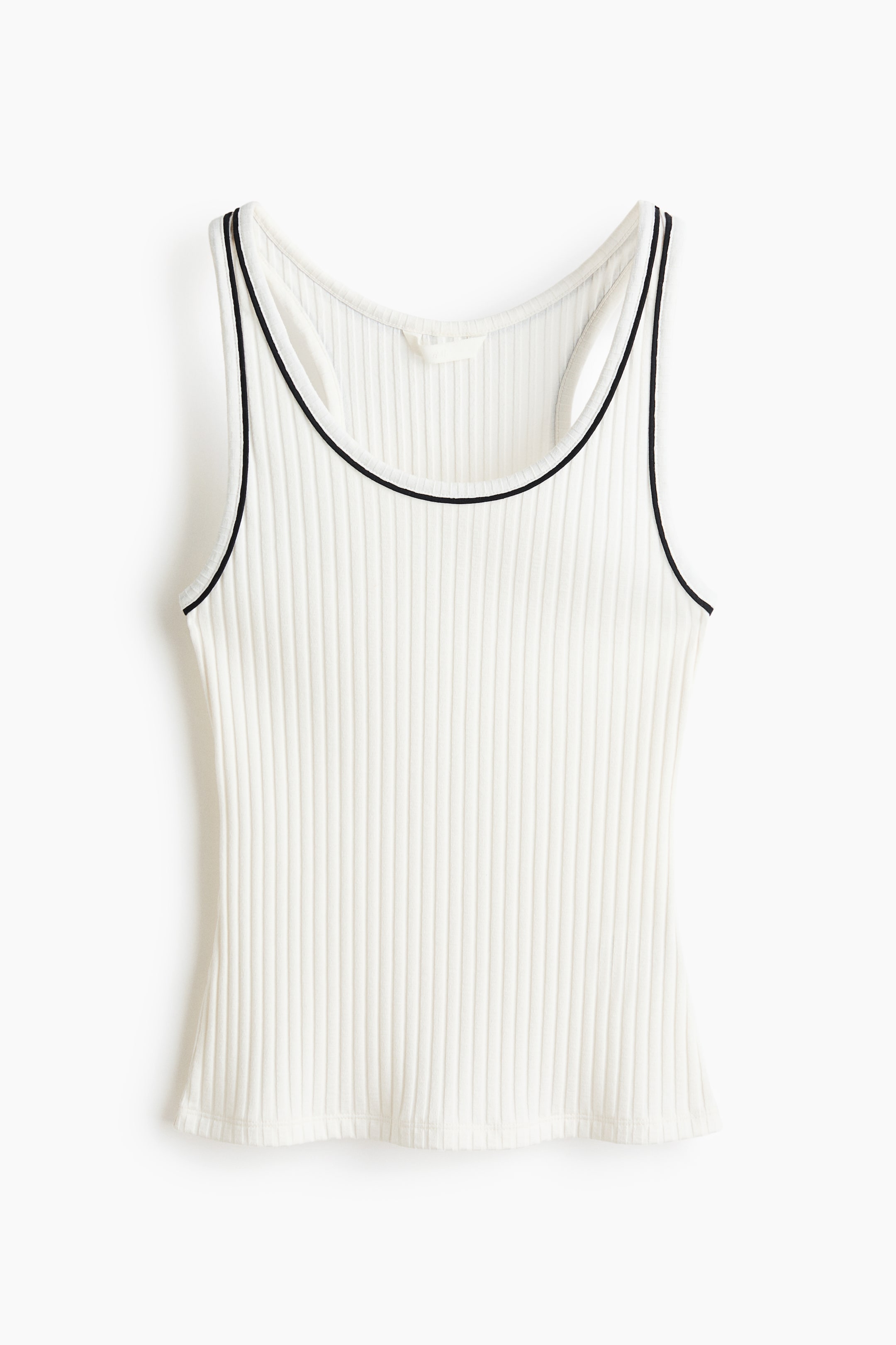 View larger image: A cream ribbed knit tank top showcases its front, highlighted by vertical ribbing and black piping outlining the scoop neckline and armholes.