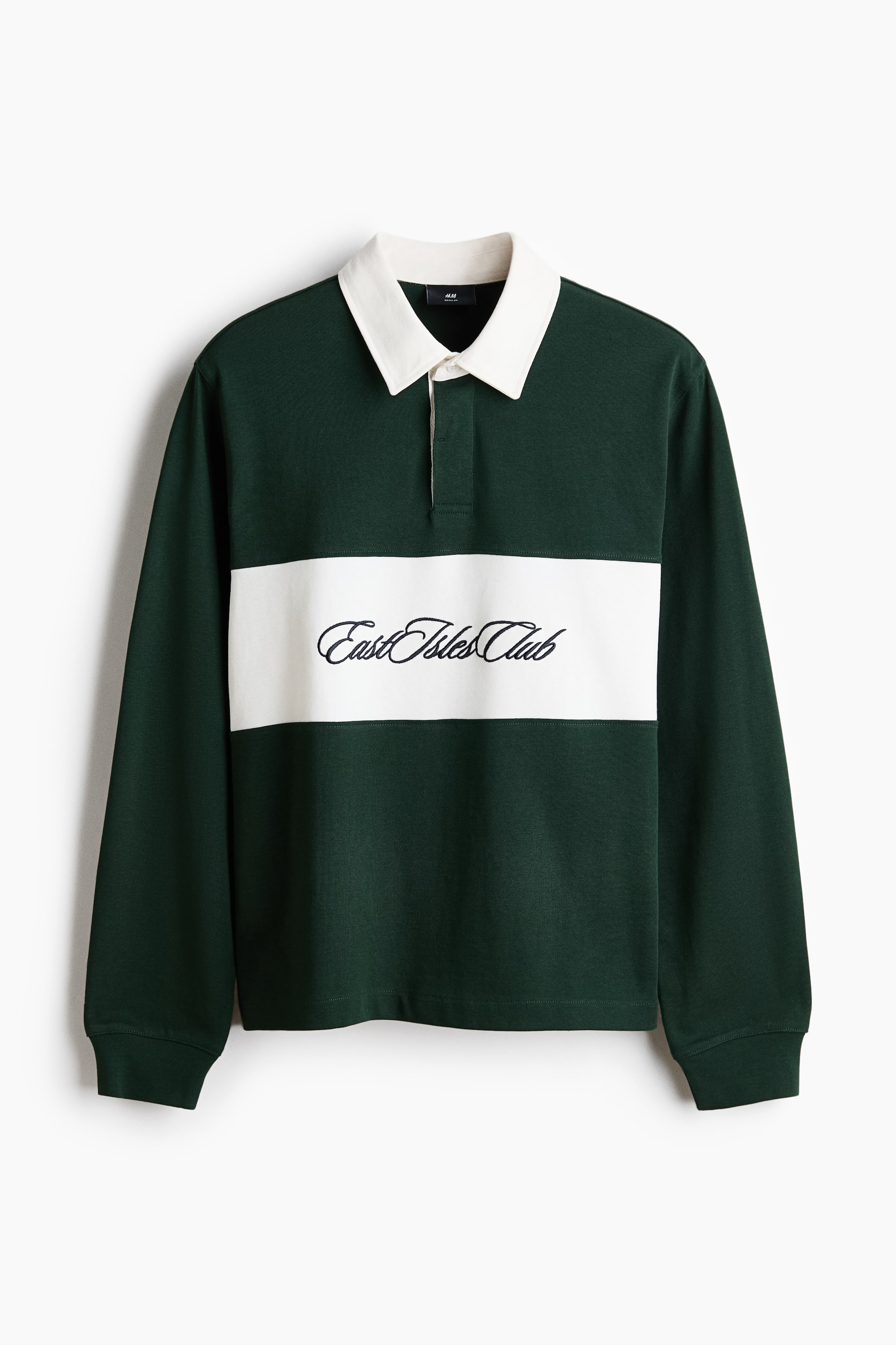 View larger image: A dark green long-sleeved polo shirt featuring a white collar, a two-button placket, and a horizontal white stripe across the chest. The white stripe displays "East Isles Club" embroidered in black script.