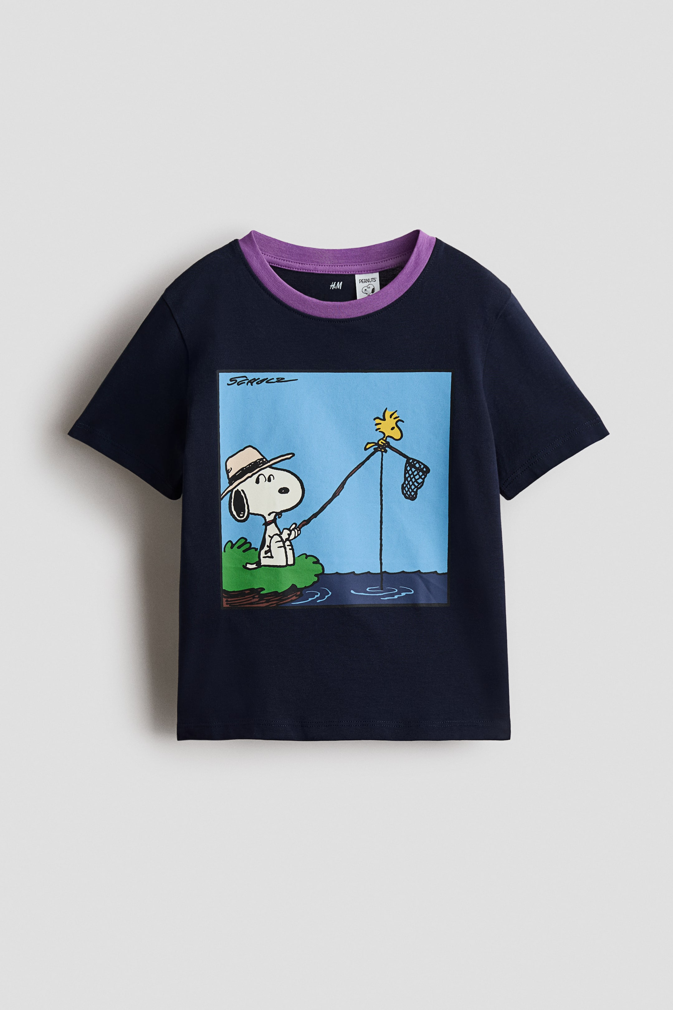 View larger image: A dark blue t-shirt is featuring a purple ribbed round neck and short sleeves. 