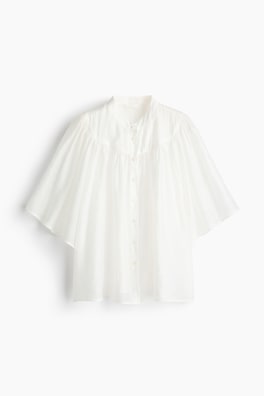 Blus med fjärilsärm