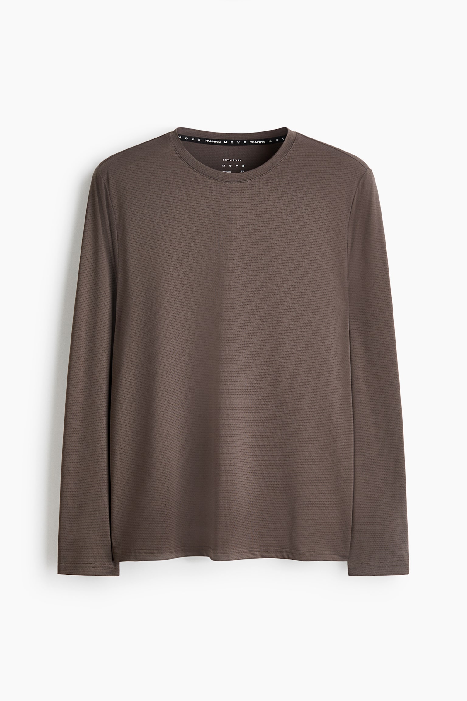 A long-sleeved athletic T-shirt in dark brown is shown front-facing, featuring a crew neckline and a finely textured knit pattern. The shirt has straight-cut sleeves and a clean hemline, with branded tape visible along the inner collar.