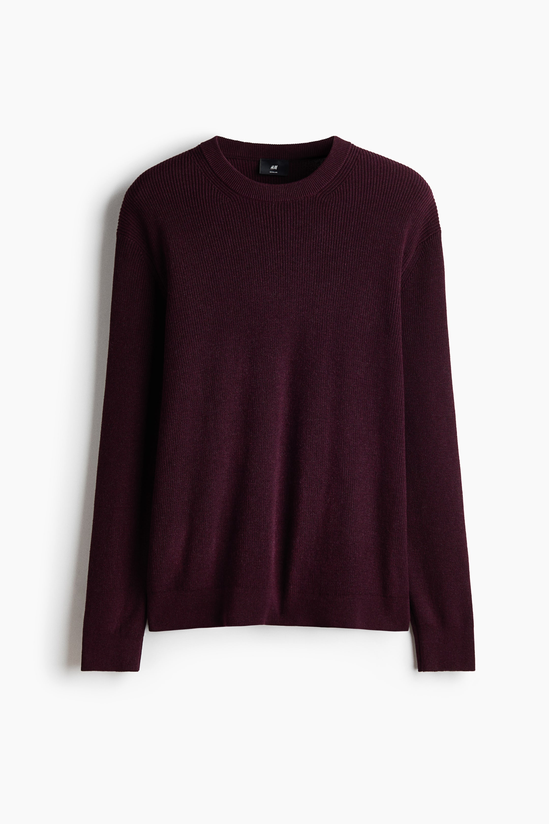 View larger image: A maroon crew-neck sweater is showcasing its front. It highlights a ribbed crew neck, shoulders, and upper sleeves, with the main body and lower sleeves displaying a fine, plain knit, and finishing with ribbed cuffs and hem.