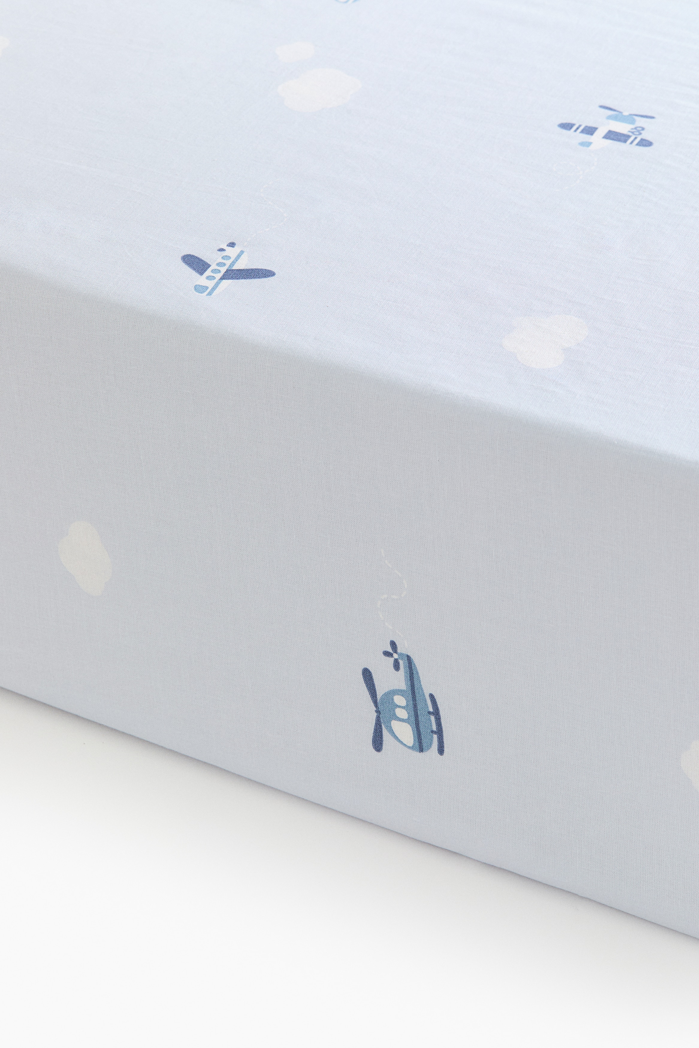 Patterned Cotton Fitted Sheet - Light blue/planes/White/cherries/Pink/floral/Cream/floral/White/hearts/White/dotted/Light beige/dinosaurs/Light blue/fish/Light green/vehicles/Light beige/unicorns/Light taupe/floral/Light pink/floral/Light yellow/oranges/Green/clover