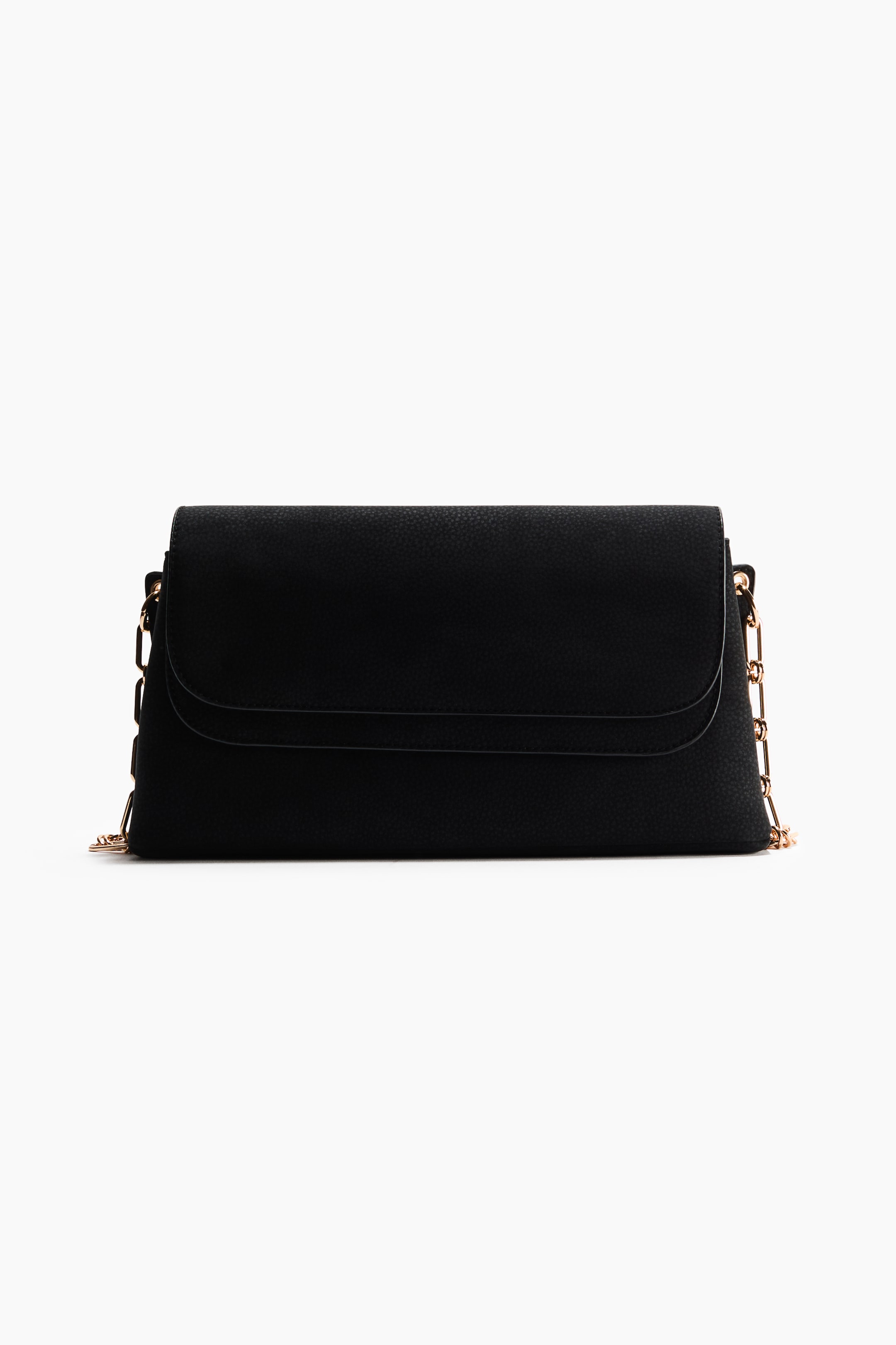 View larger image: A textured black shoulder bag is shown from the front, featuring a layered-look top flap with rounded edges. Gold-toned metal chain straps are attached to the sides and drape down.