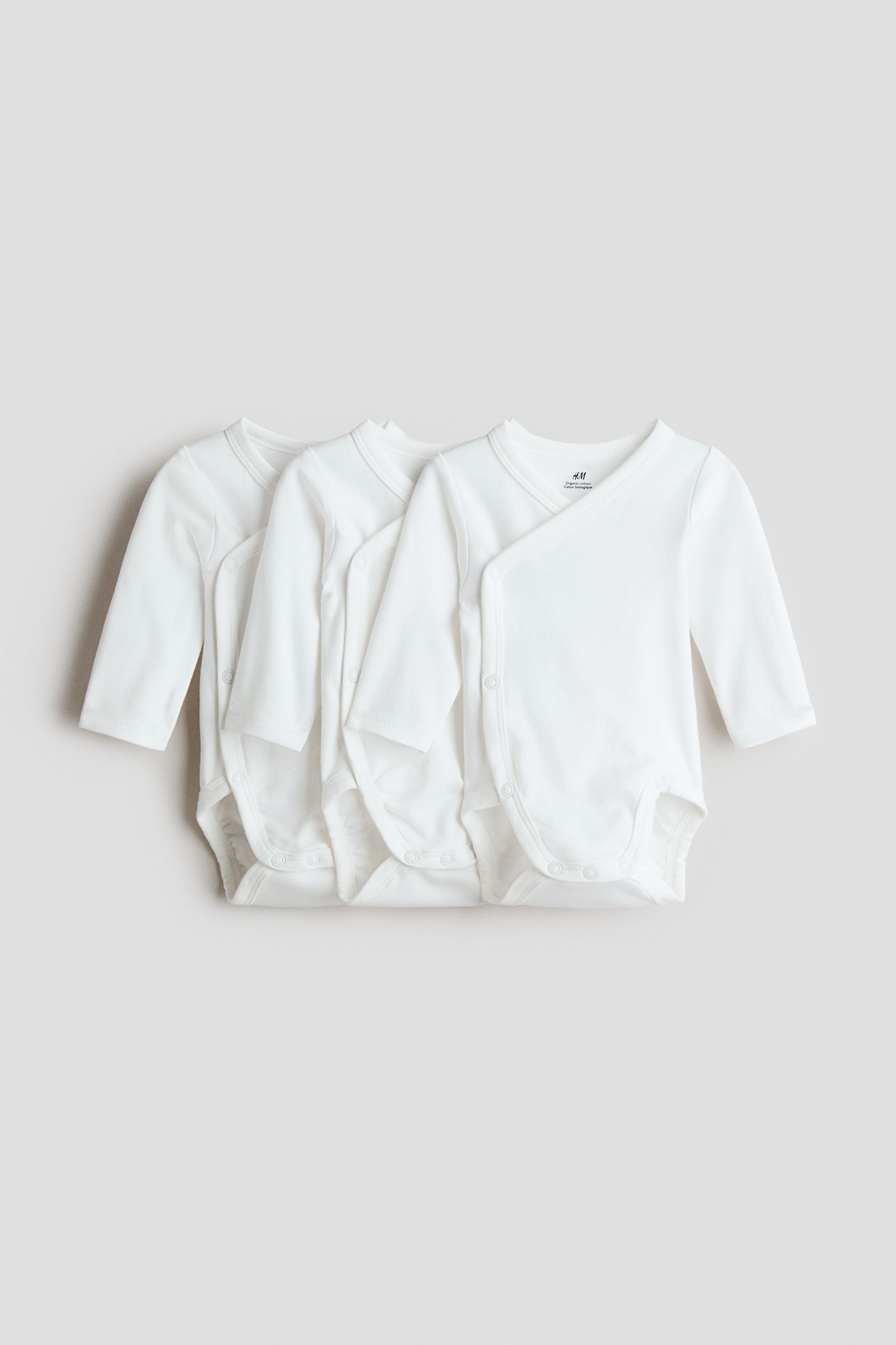 Ver imagen más grande: Pack de 3 bodies cruzados - Blanco - NIÑOS | H&M ES 1