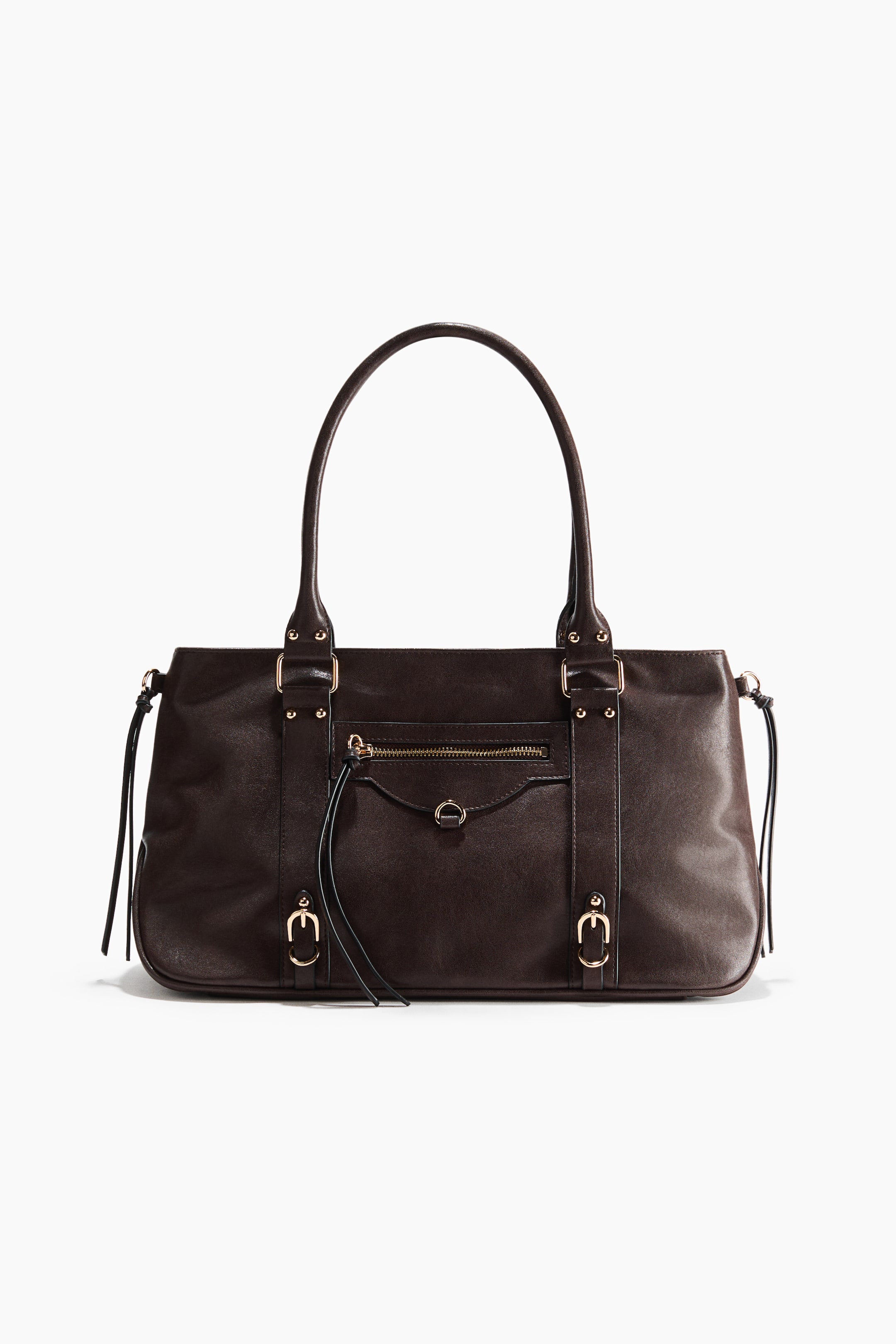 View larger image: A dark brown handbag is facing forward, featuring two slender top handles. Its front displays a horizontal zippered pocket and a small flap pocket, while gold-toned hardware and decorative tassels accent its design.