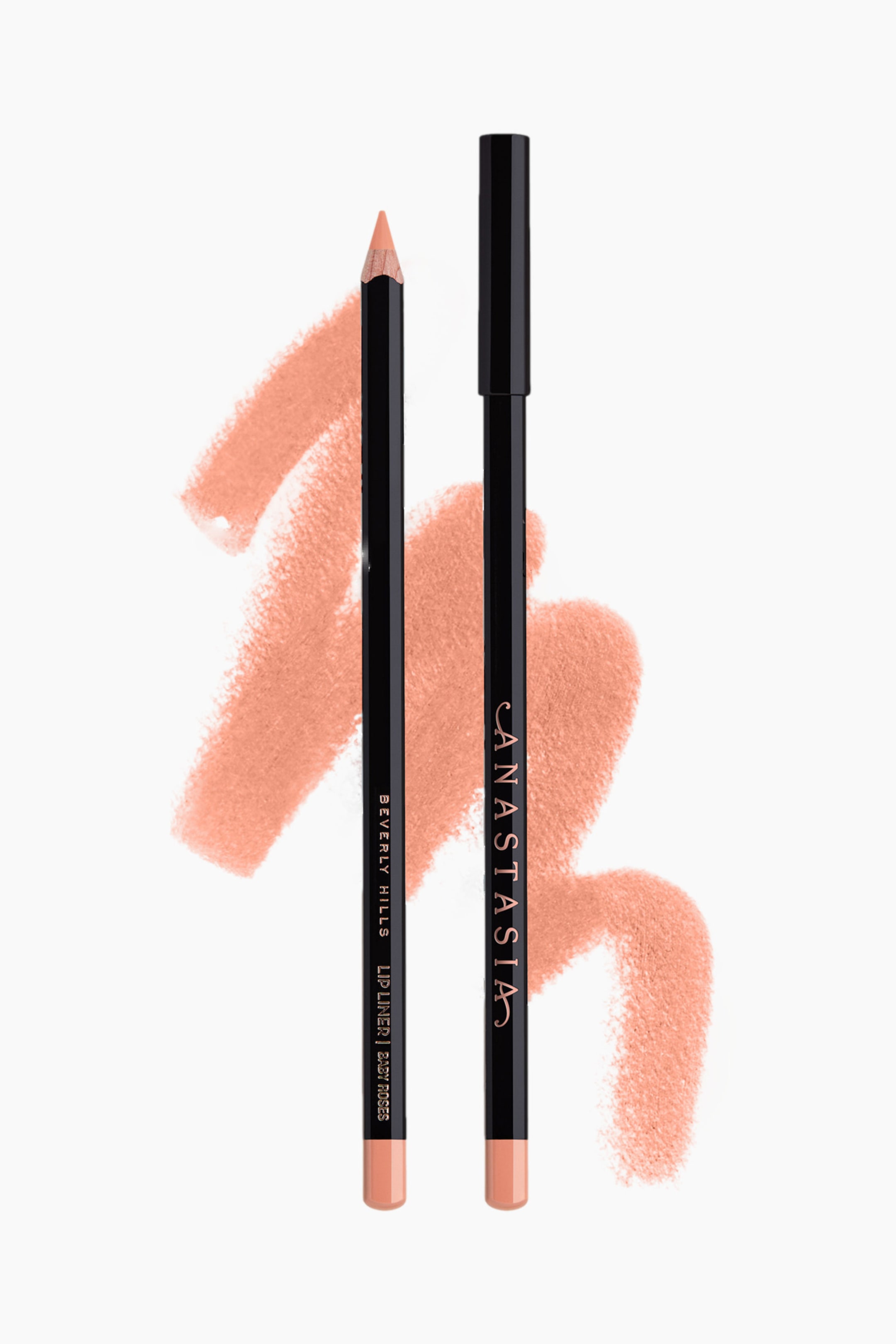 Se større billede: To sorte liplinere er præsenteret, begge med et lyst ferskenfarvet produkt. Den venstre liner er let vinklet og viser en spids spids samt sin base i ferskenfarve med teksten "Beverly Hills Lip Liner | Baby Roses", mens den højre liner står oprejst, med sort hætte, og viser sin ferskenfarvede base samt teksten "Anastasia". Farveprøver af den samme lyse ferskenfarve ses bag begge produkter.