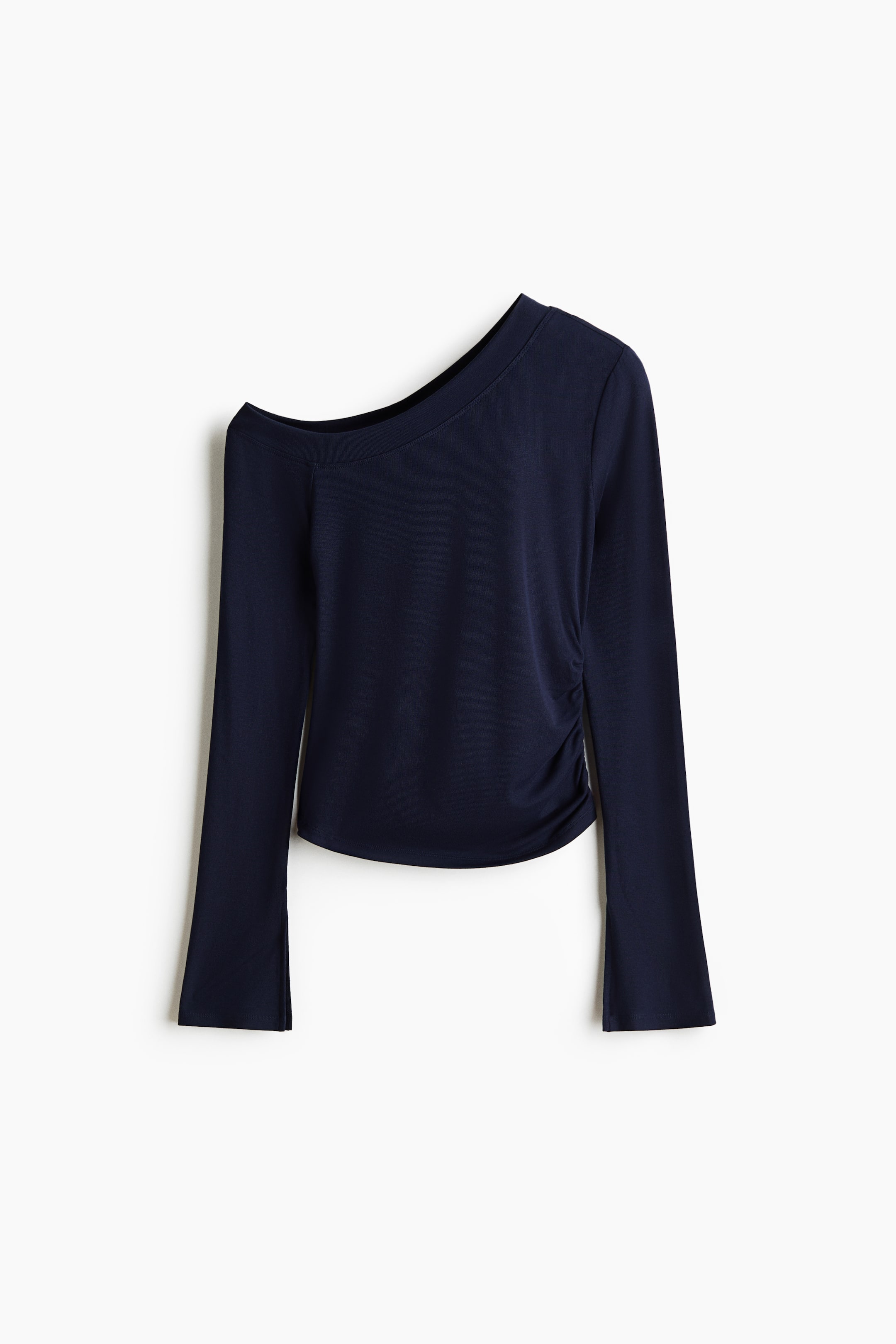 View larger image: A dark blue rib-knit one-shoulder top is shown from the front. It features an asymmetric neckline, long sleeves with slits at the cuffs, a gathered seam at one side of the waist creating a ruched effect, and a gently rounded hem.