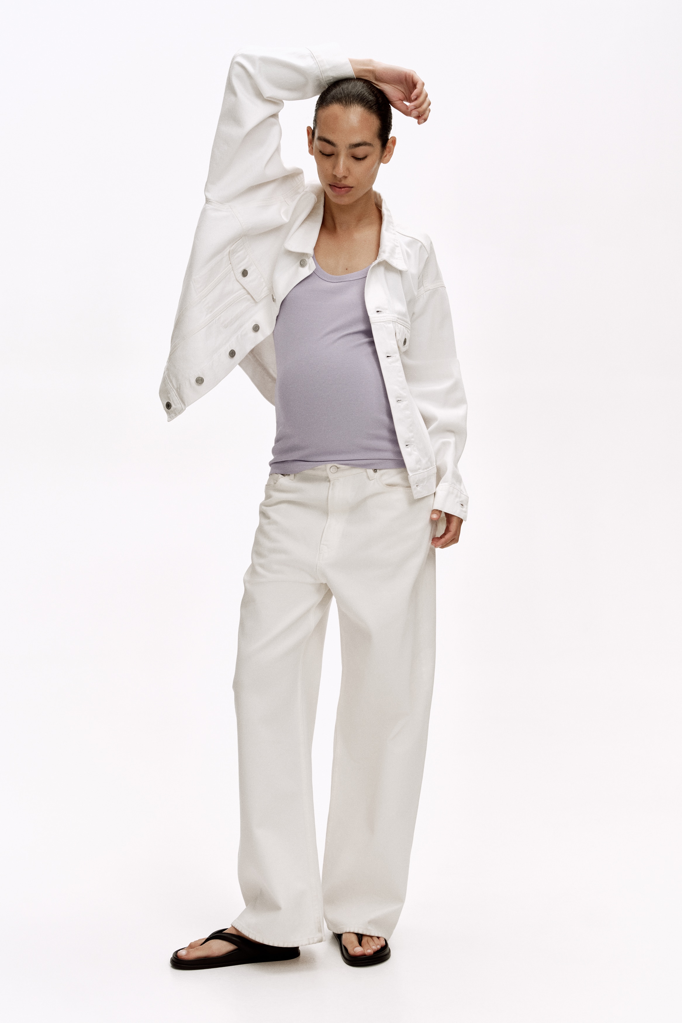 A light purple ribbed cotton jersey vest top is facing front, featuring a scoop neckline, standard straps, and a straight-cut hem.