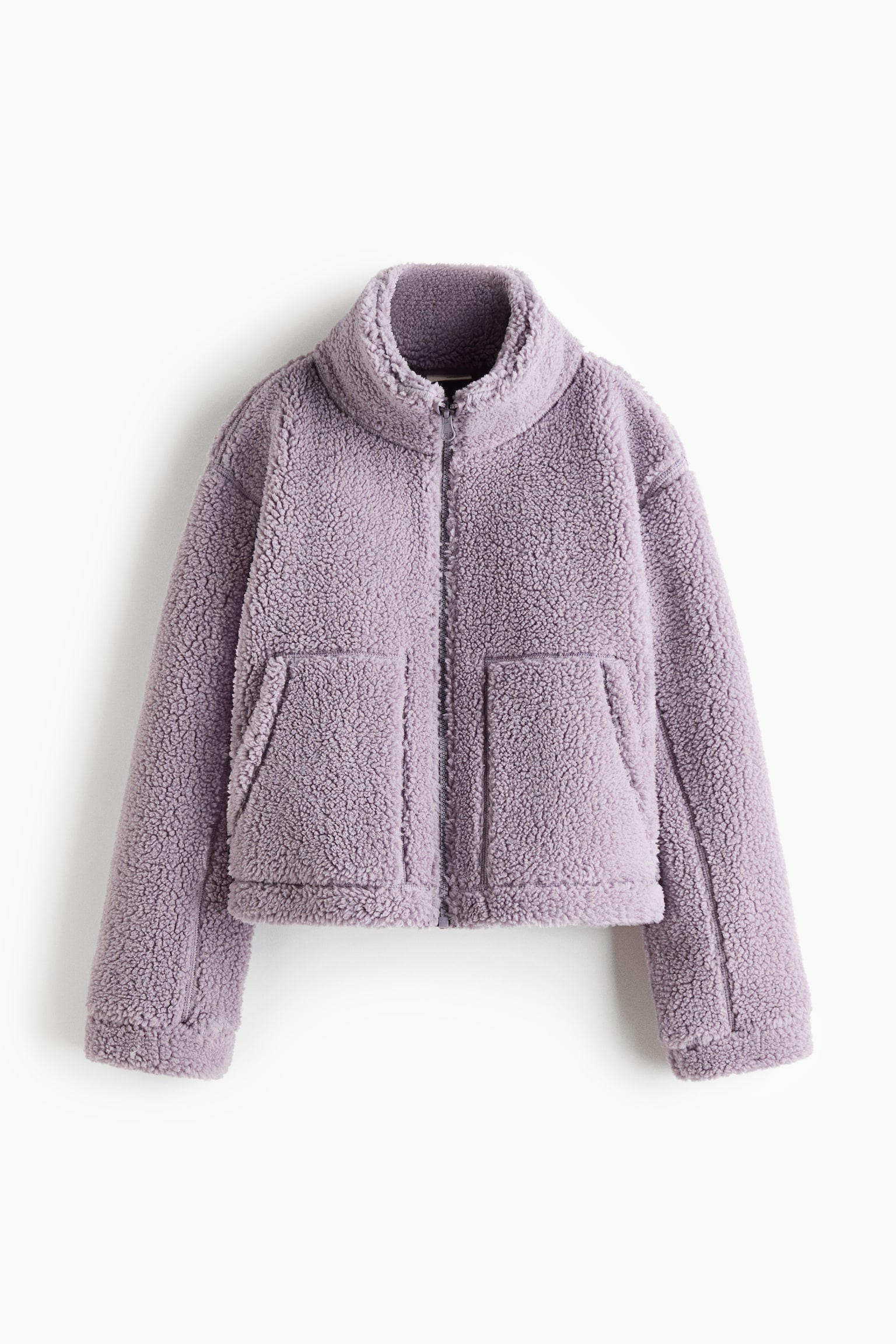 A purple sherpa fleece jacket is facing front, displaying a full-zip closure and a stand-up collar. The cropped jacket is featuring two large patch pockets on its lower front. - 1