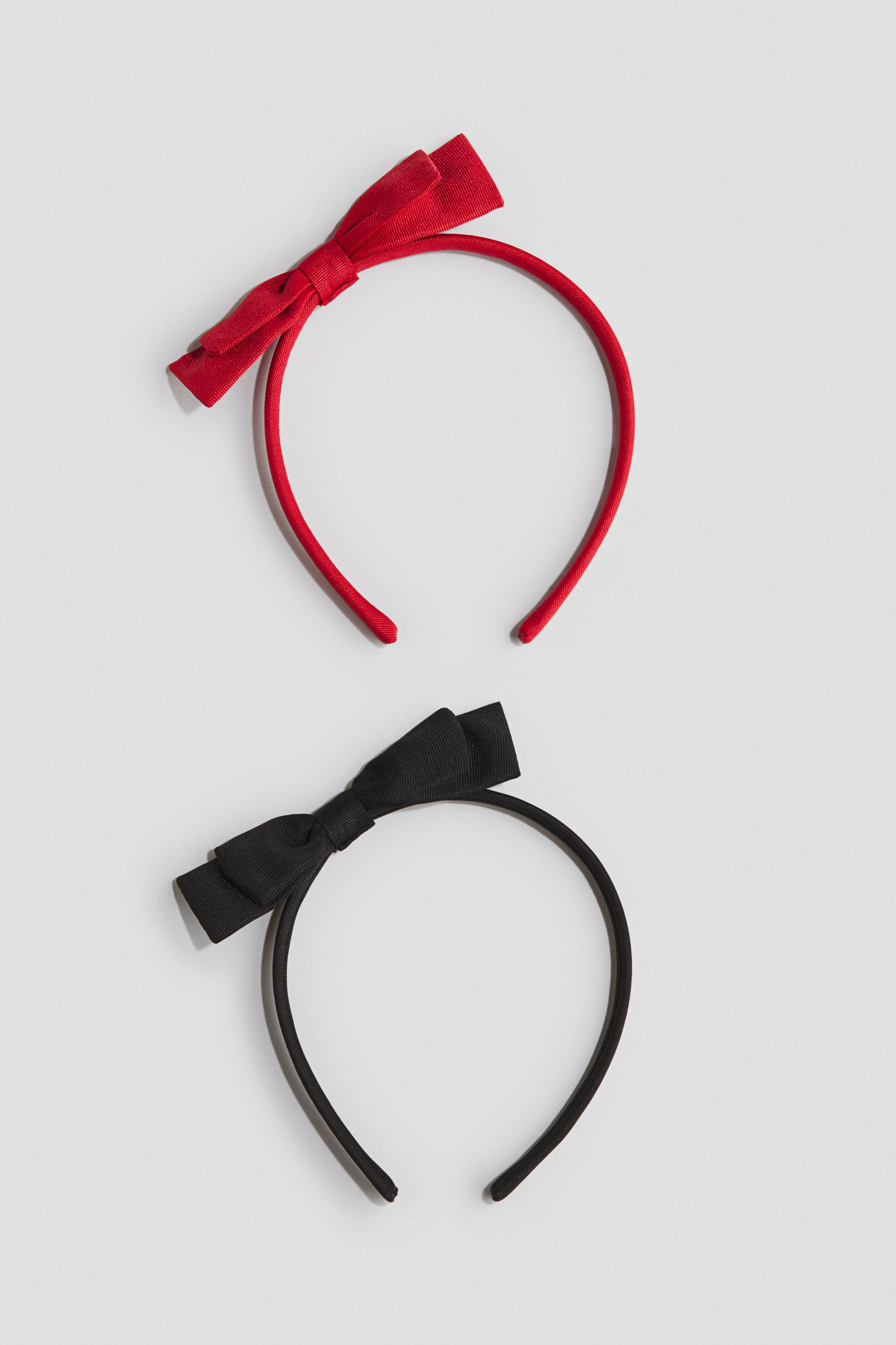 Переглянути збільшене зображення: 2-pack bow-appliqué Alice bands - Red/Black - Kids | H&M UA 1