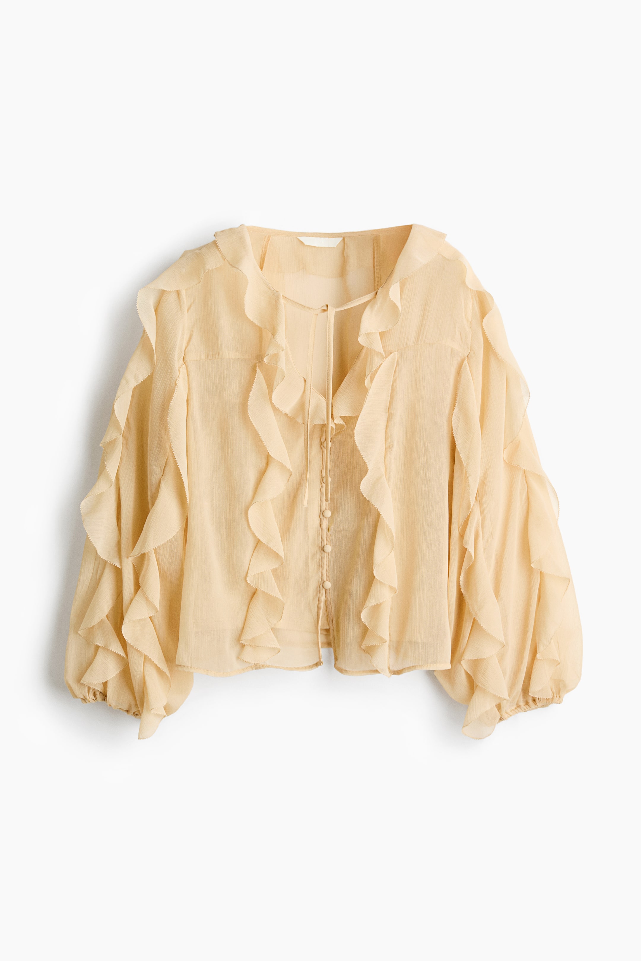 View larger image: Front view: a light yellow sheer blouse featuring a V-neckline with ties and a button-down front with small buttons. Cascading ruffles flank the button placket and extend along the voluminous long sleeves, which end in elasticated cuffs.