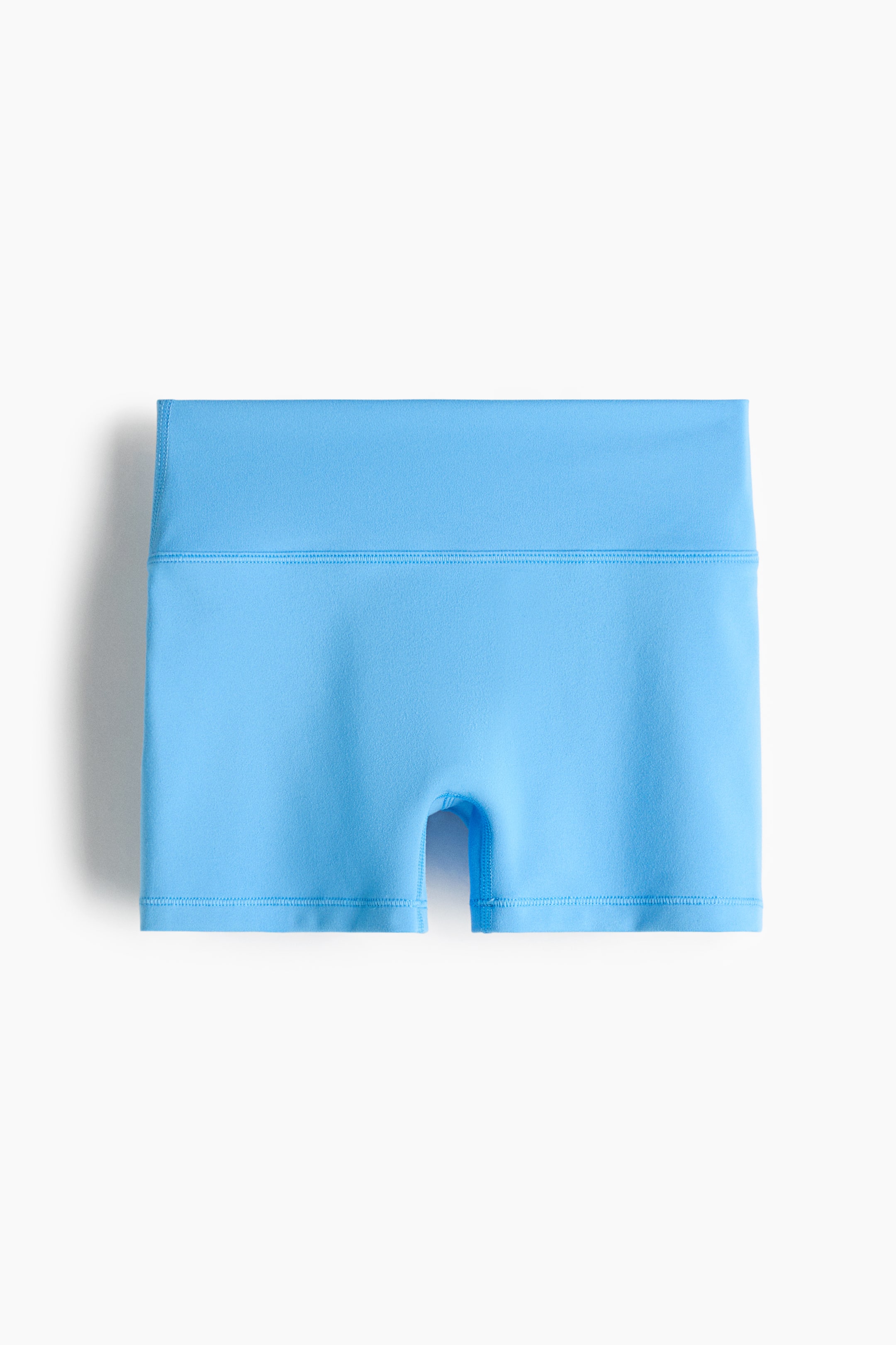 View larger image: Sports hotpants with SoftMove? are showcased front-facing, highlighting a light blue hue. They feature a wide, flat waistband with double stitching, short, fitted legs with visible hem stitching, and a visible gusset in the crotch area.