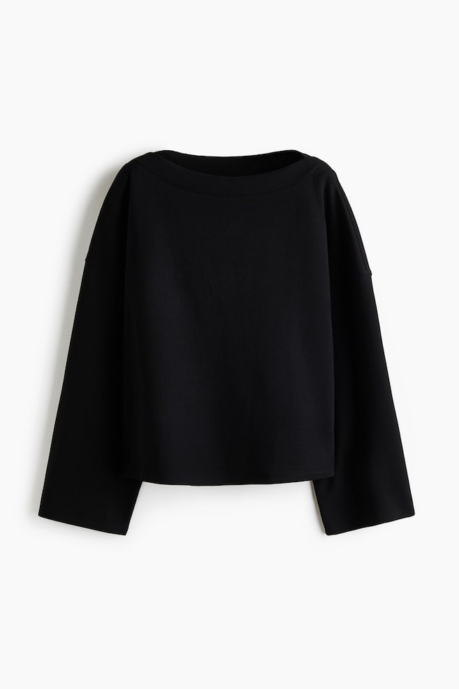A loose-fit black sweater is shown from the front, featuring a wide boat neckline, low dropped shoulders, and long, wide sleeves. - 1