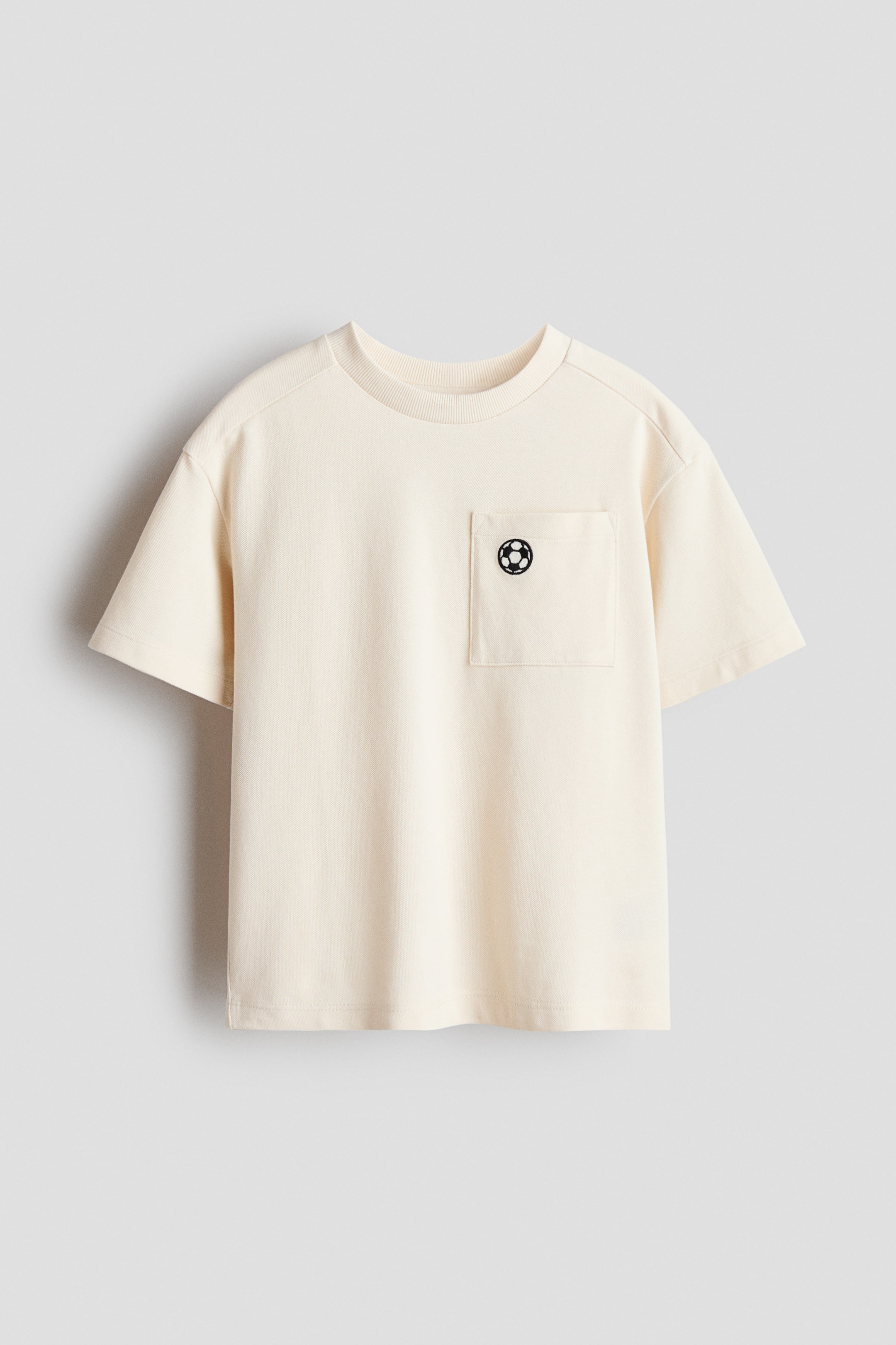 View larger image: Embroidered-Detail Piqué T-Shirt - Light beige/Football - Kids | H&M US 1